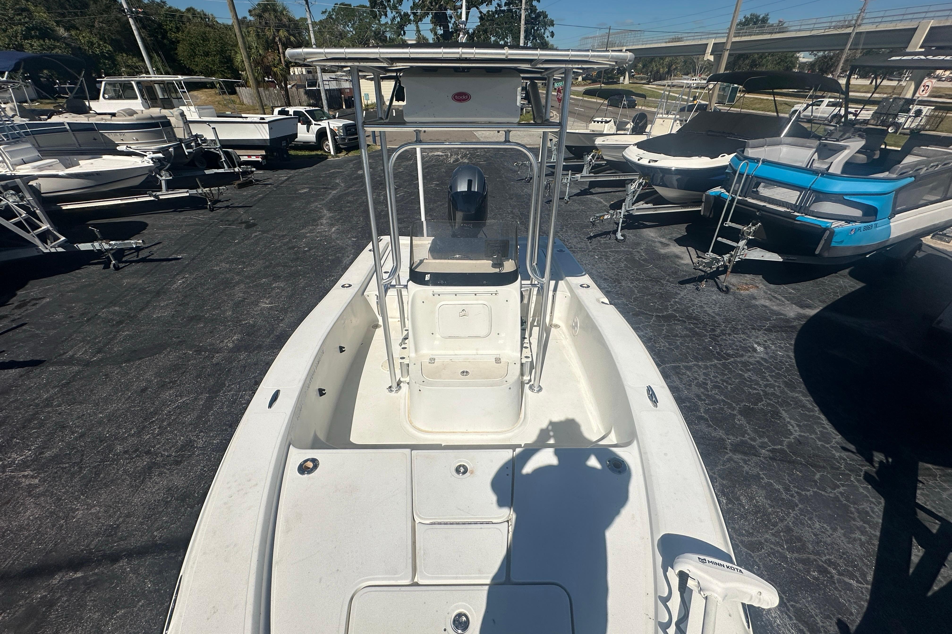 2003 Hydra-Sports 19 Bay Bolt boat, white deck, parked among other boats.