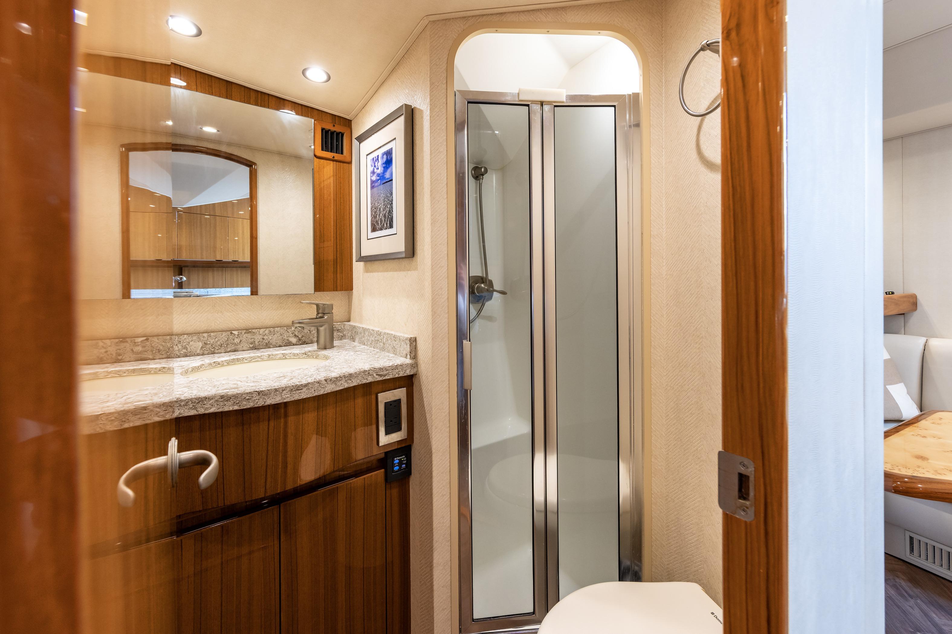 Luxurious bathroom interior of 2017 Viking 52 Sport Tower yacht.