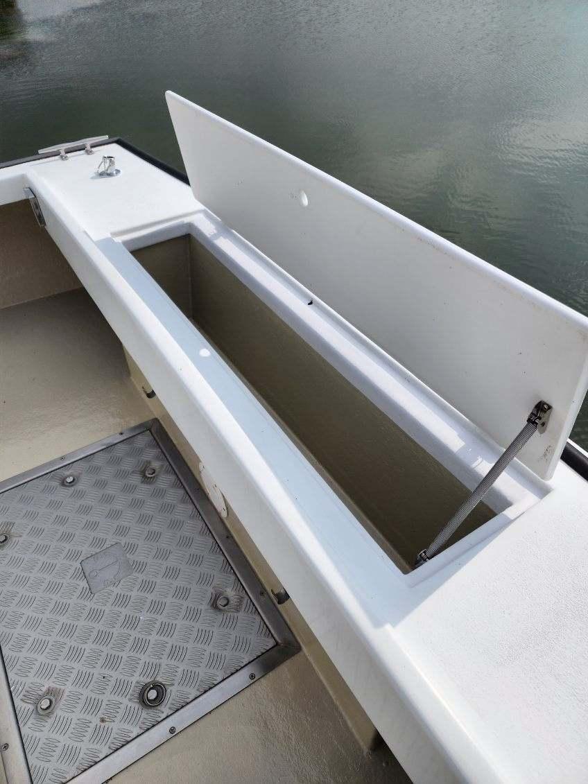 Open storage compartment on 2016 Custom Broad Creek 32 Downeast boat.