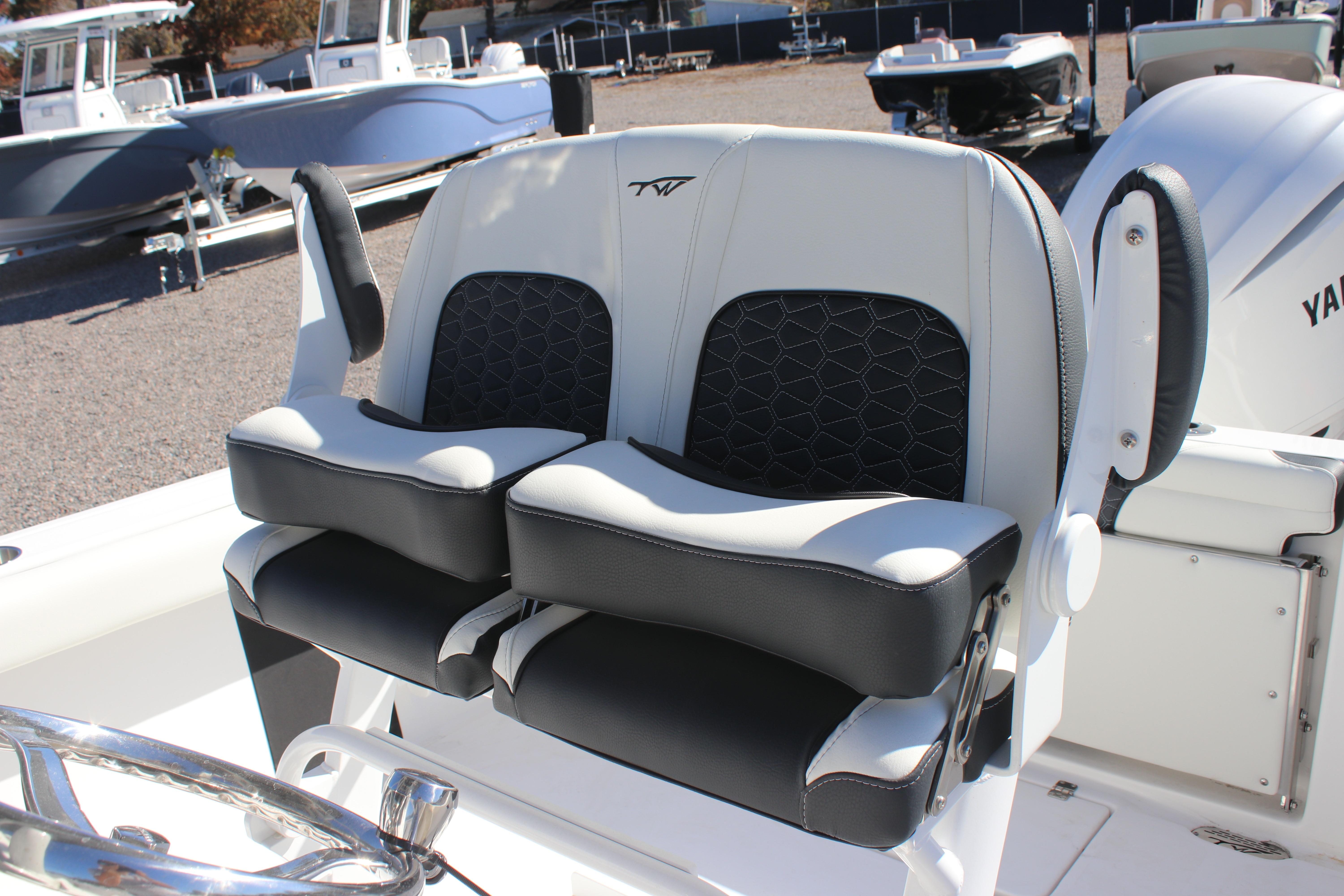 Tidewater 232 CC Adventure 2026 boat seats with black and white upholstery.