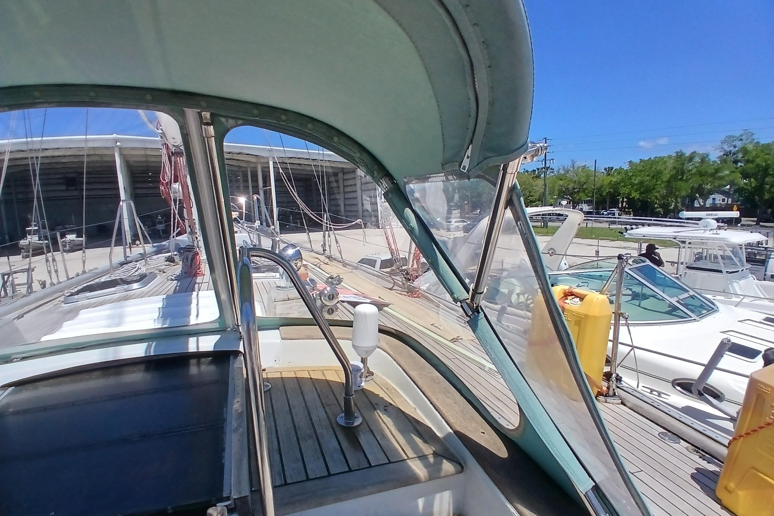Cockpit view of 1981 Kaufman Skye 51 sailboat docked at marina.