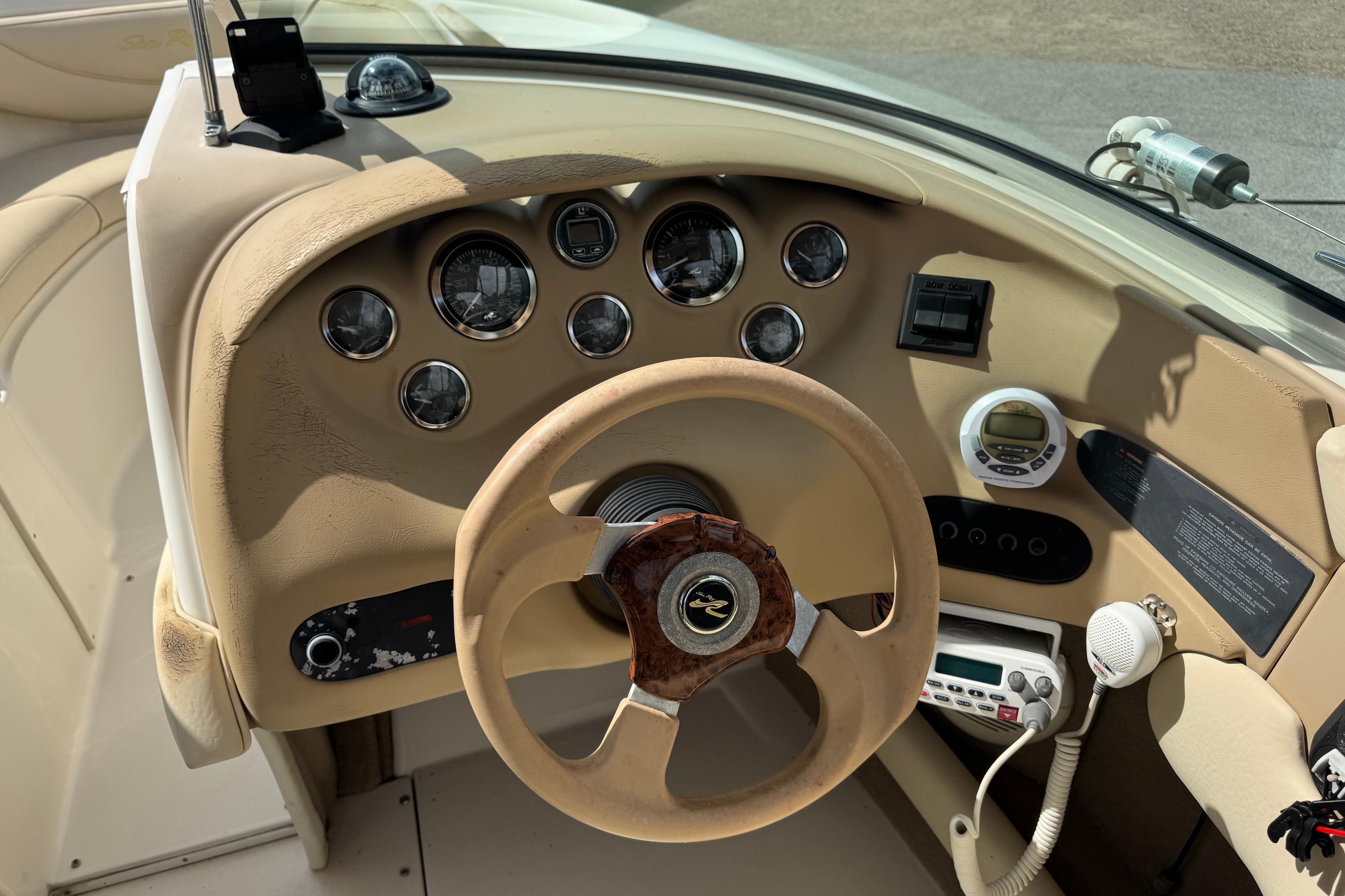 2001 Sea Ray 210 Bow Rider dashboard with steering wheel and instrument panel.