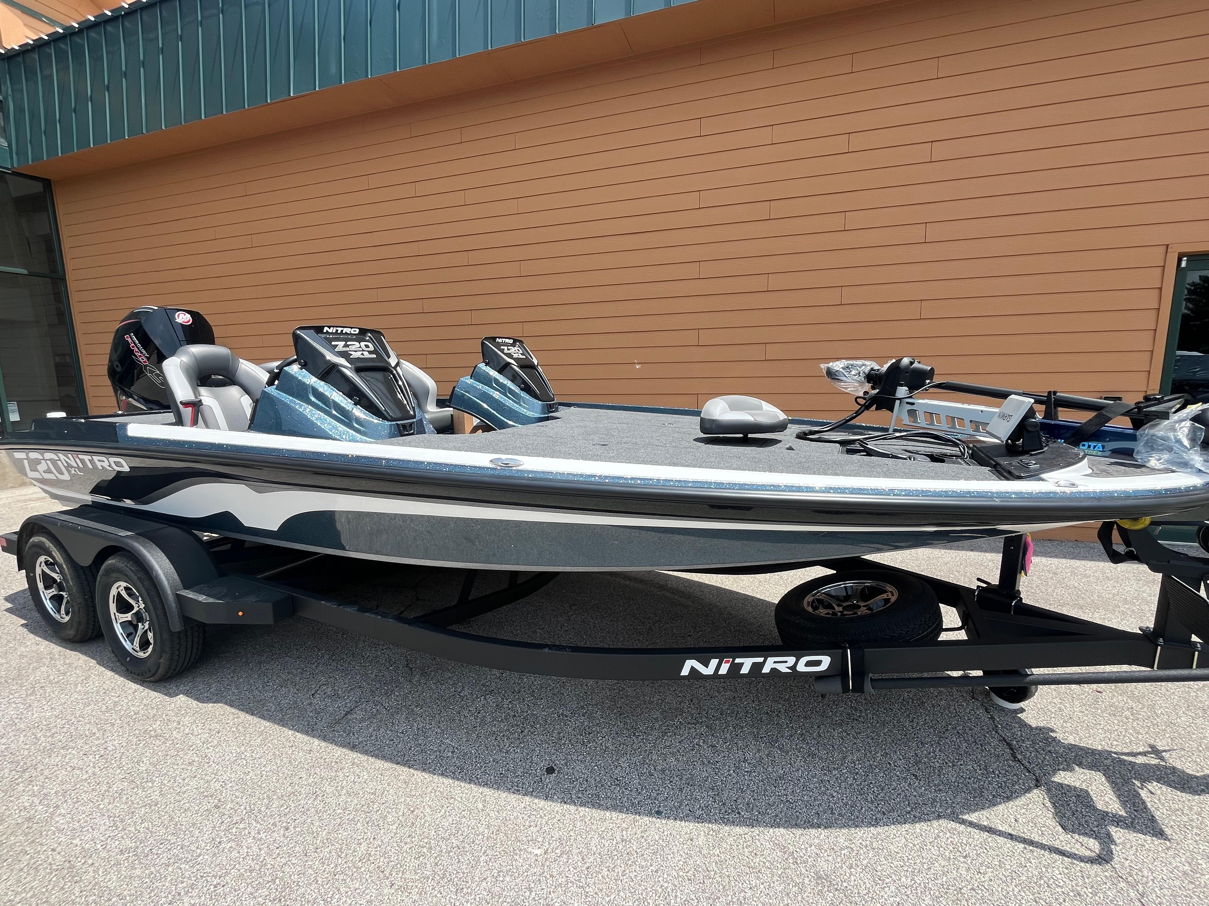 2025 Nitro Z20 XL Pro boat on trailer, parked outside a building.