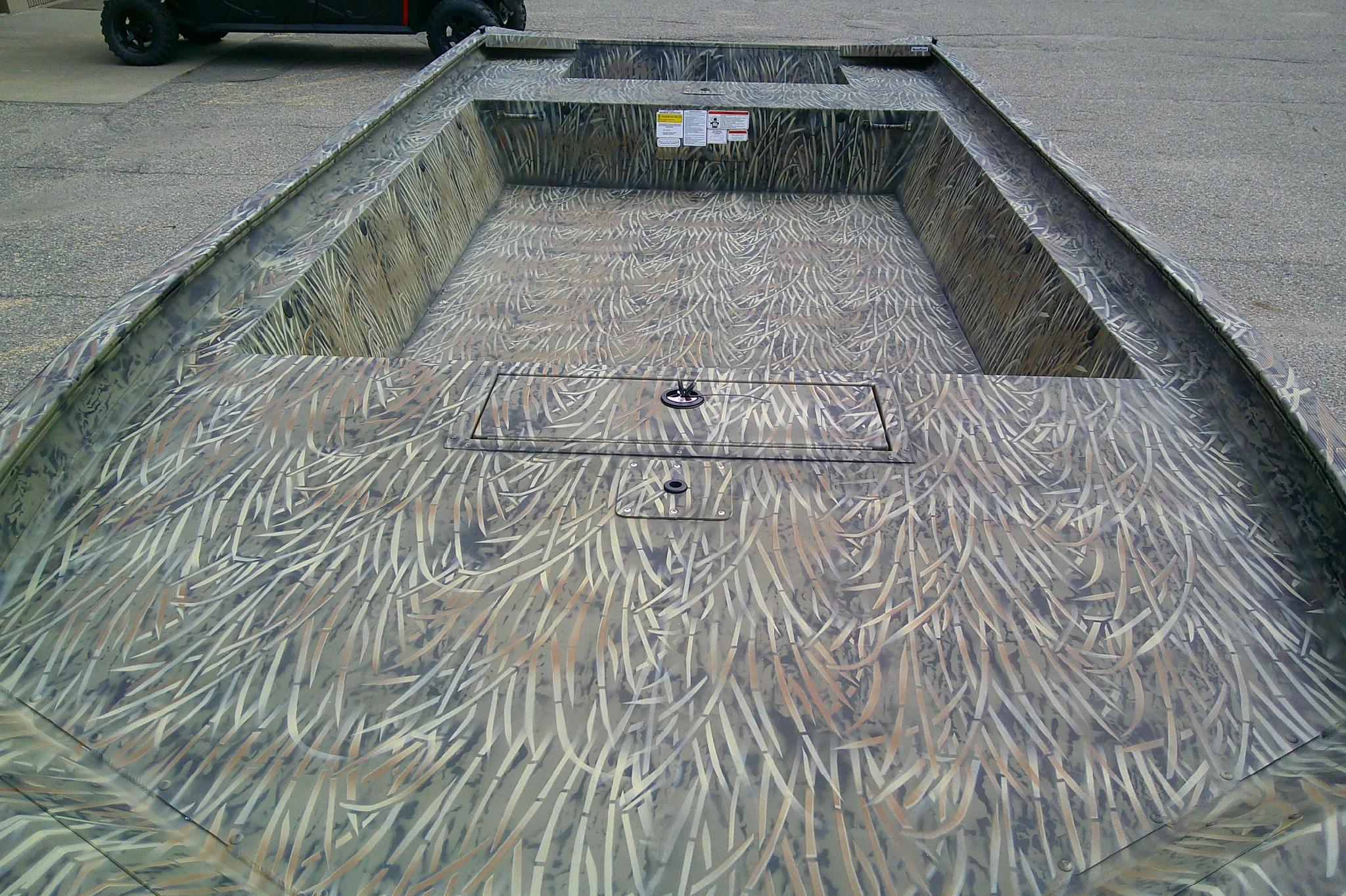 2026 Tracker Grizzly 1860 Utility boat with camouflage interior design.