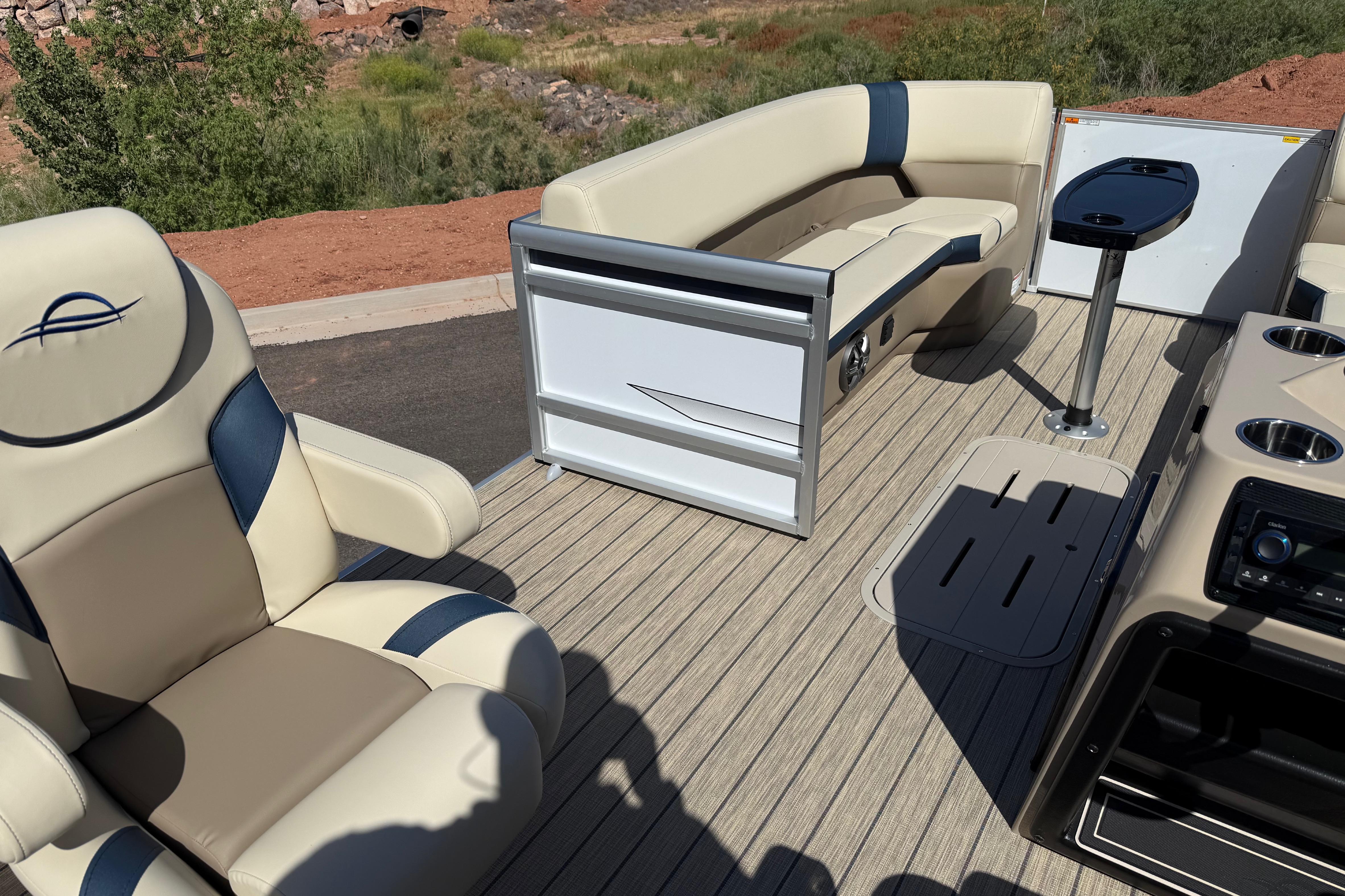 Luxurious interior of 2026 SunCatcher Select 322SL pontoon boat with plush seating and sleek design.
