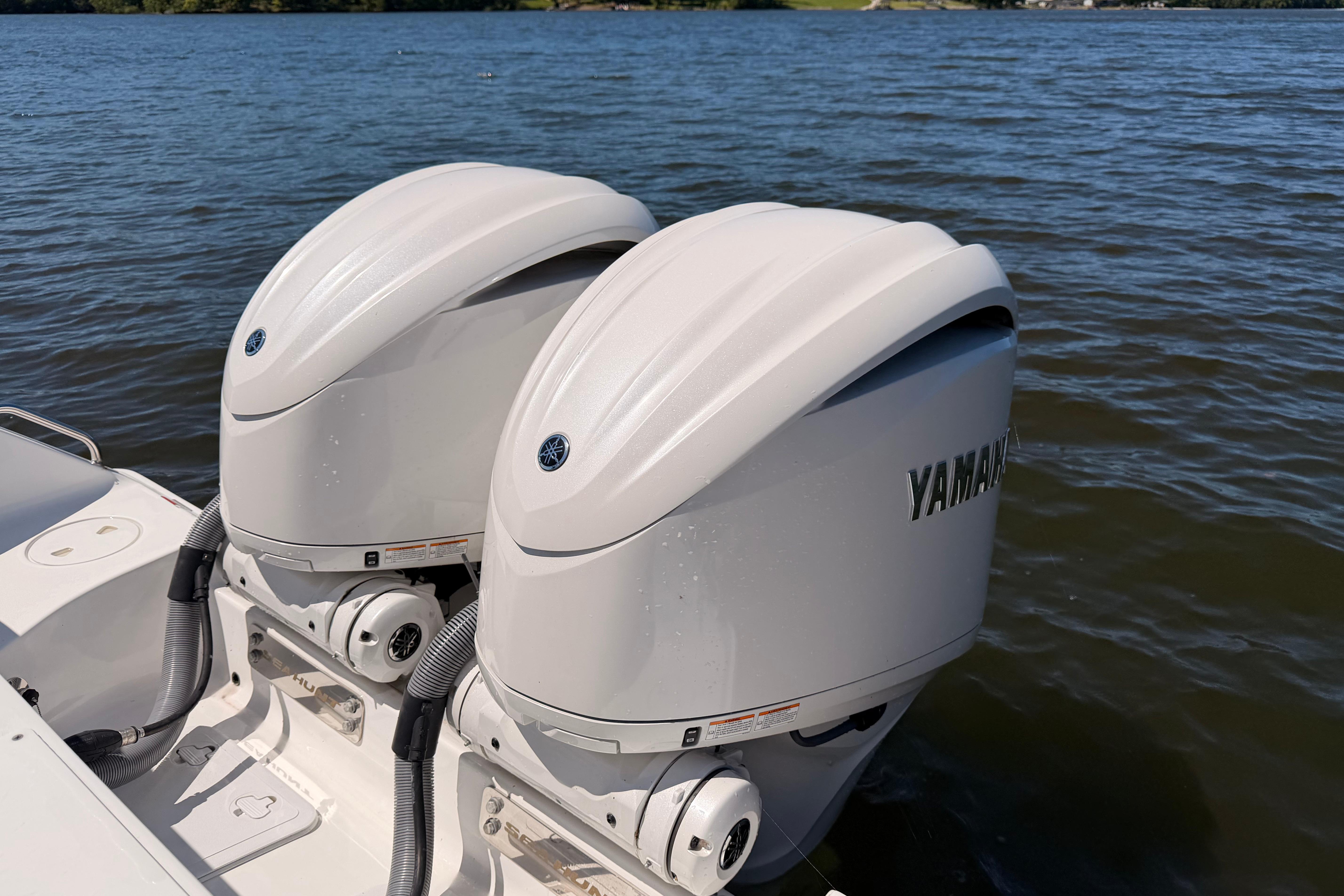 2024 Sea Hunt Gamefish 27 Coffin Box with dual Yamaha outboard motors on water.