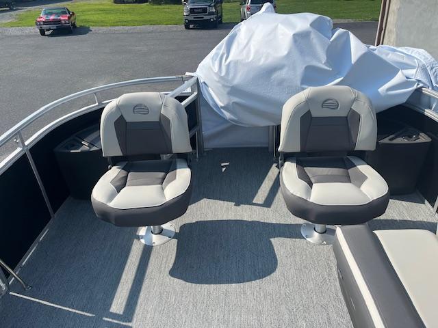 2026 Sun Tracker Fishin' Barge 20 DLX with two swivel seats on deck.
