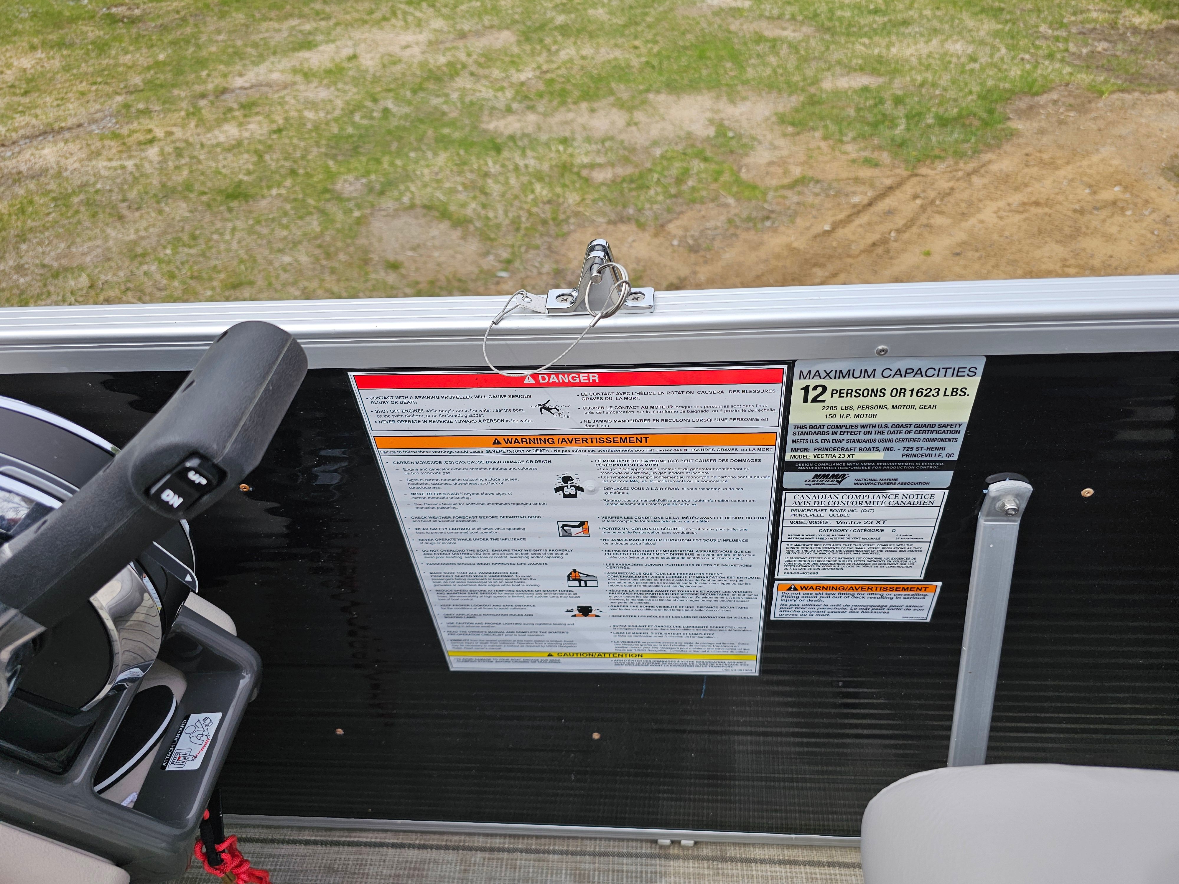 Safety and capacity labels on a 2021 Princecraft Vectra 23XT boat.
