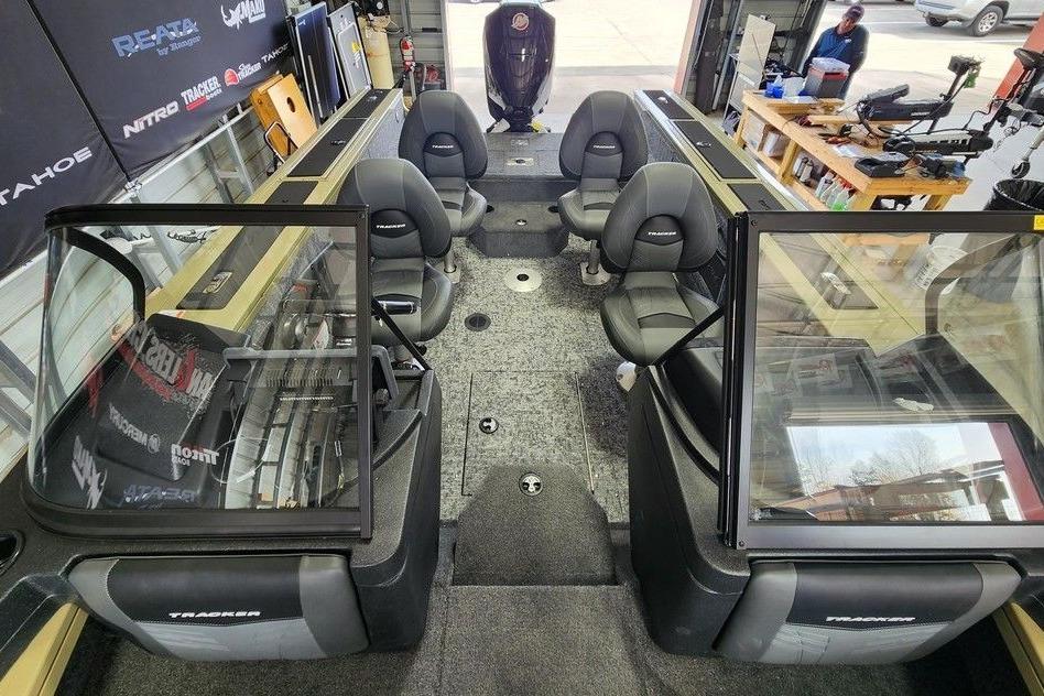 2026 Tracker Targa 185 WT boat interior with seating and equipment in a workshop.