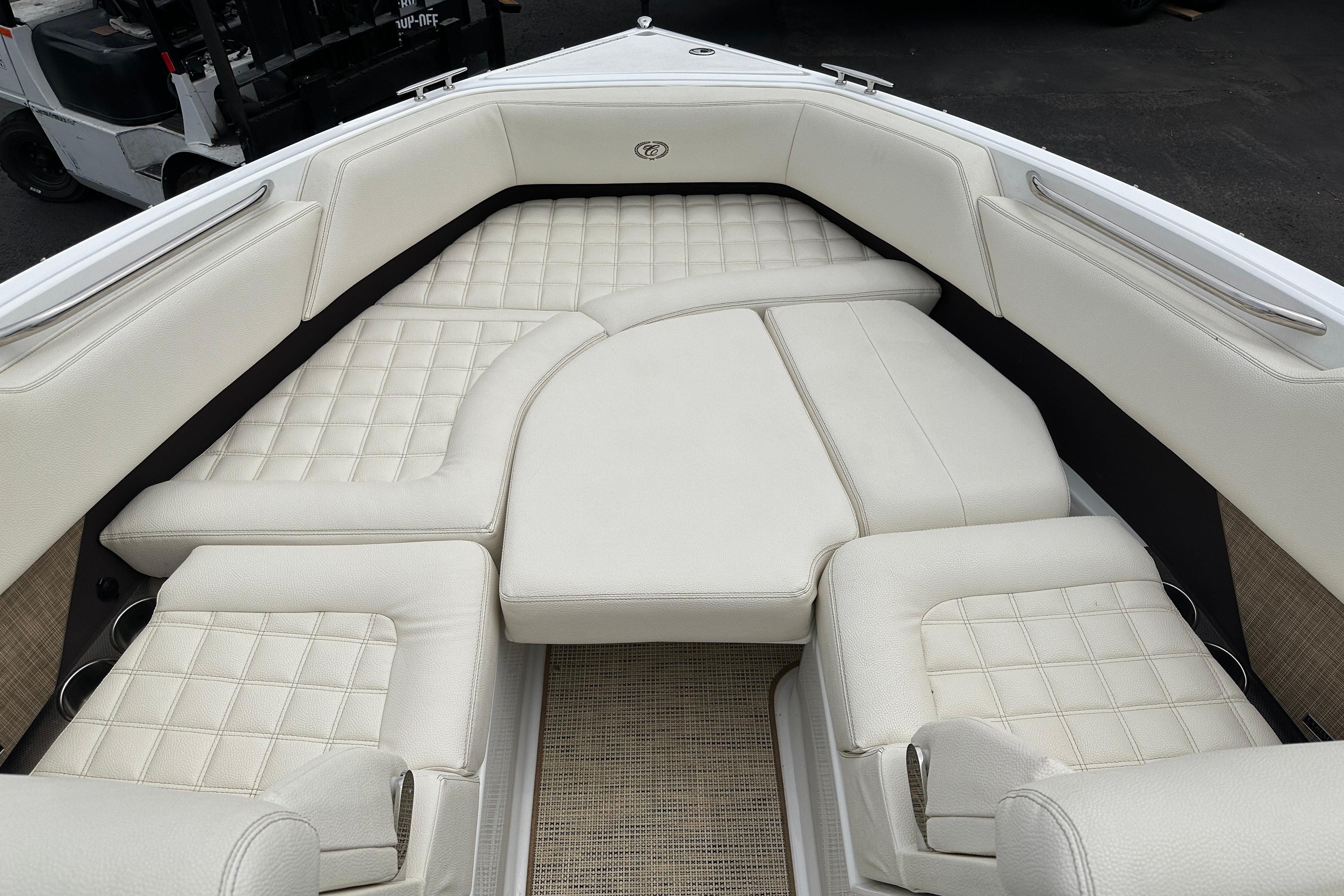 Luxurious seating area on a 2019 Cobalt R5 boat with white upholstery.