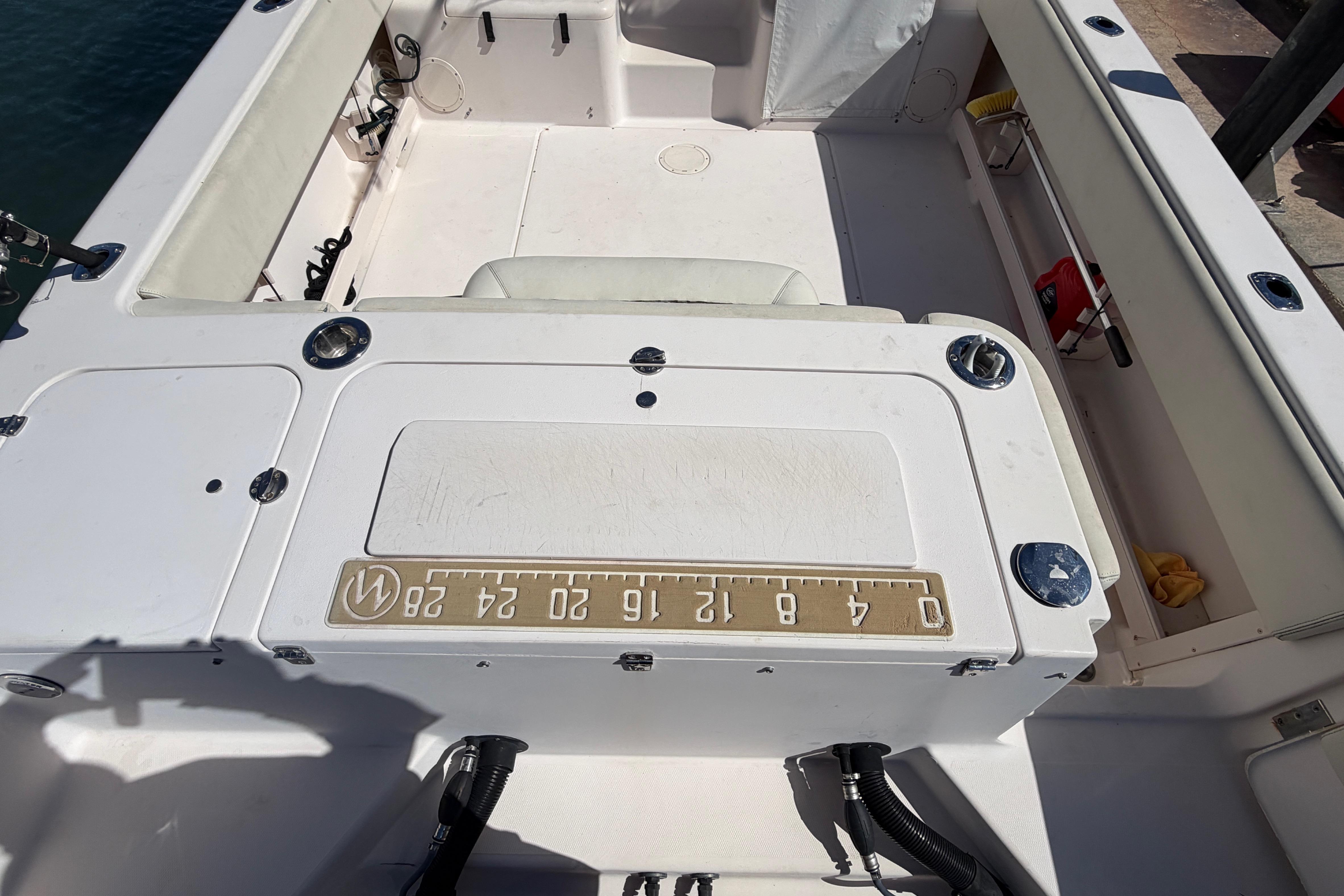 2006 Grady-White Sailfish 282 boat interior with measuring board and seating area.