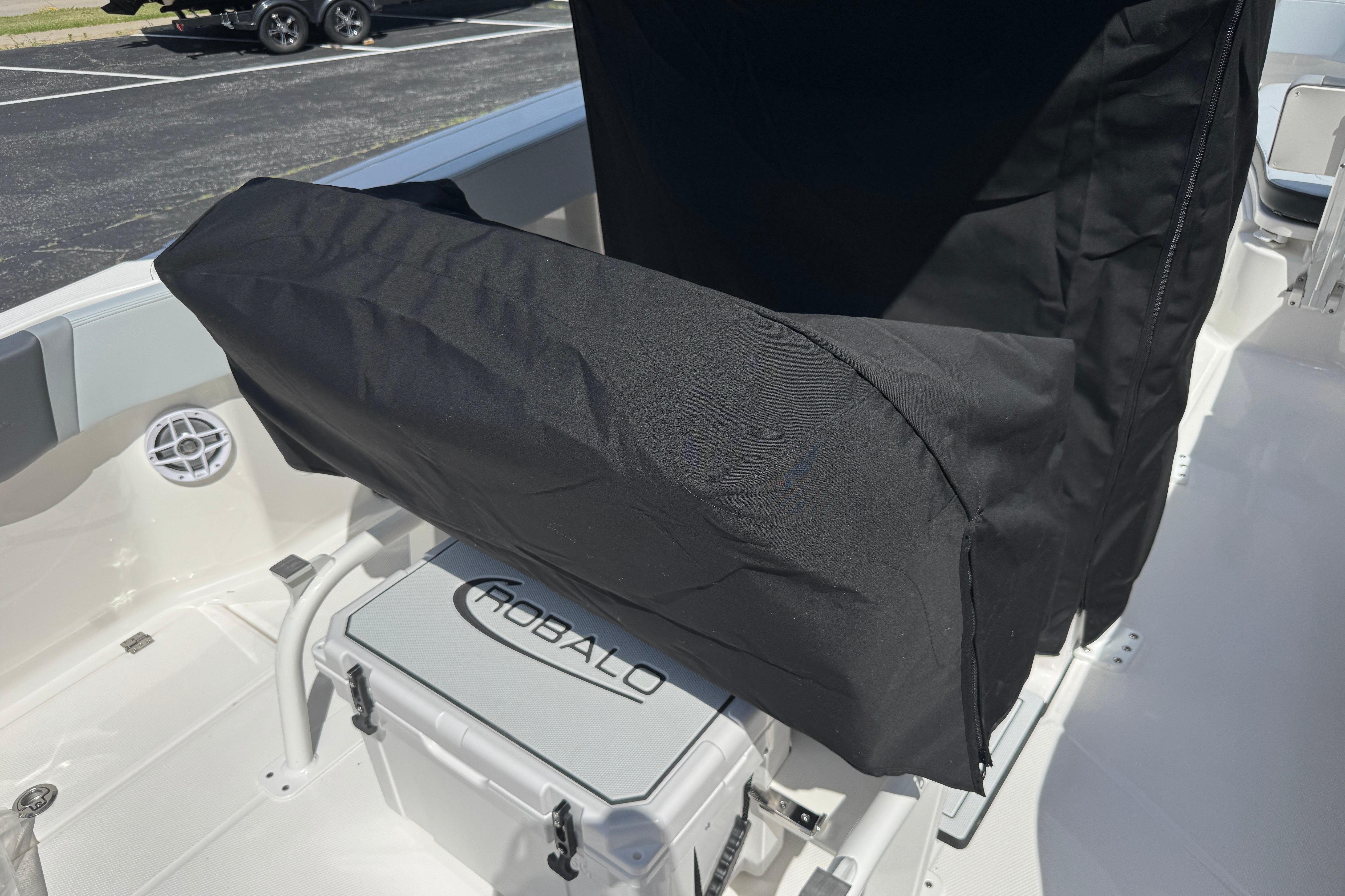 2026 Robalo R250 Center Console boat interior with covered seating and storage.