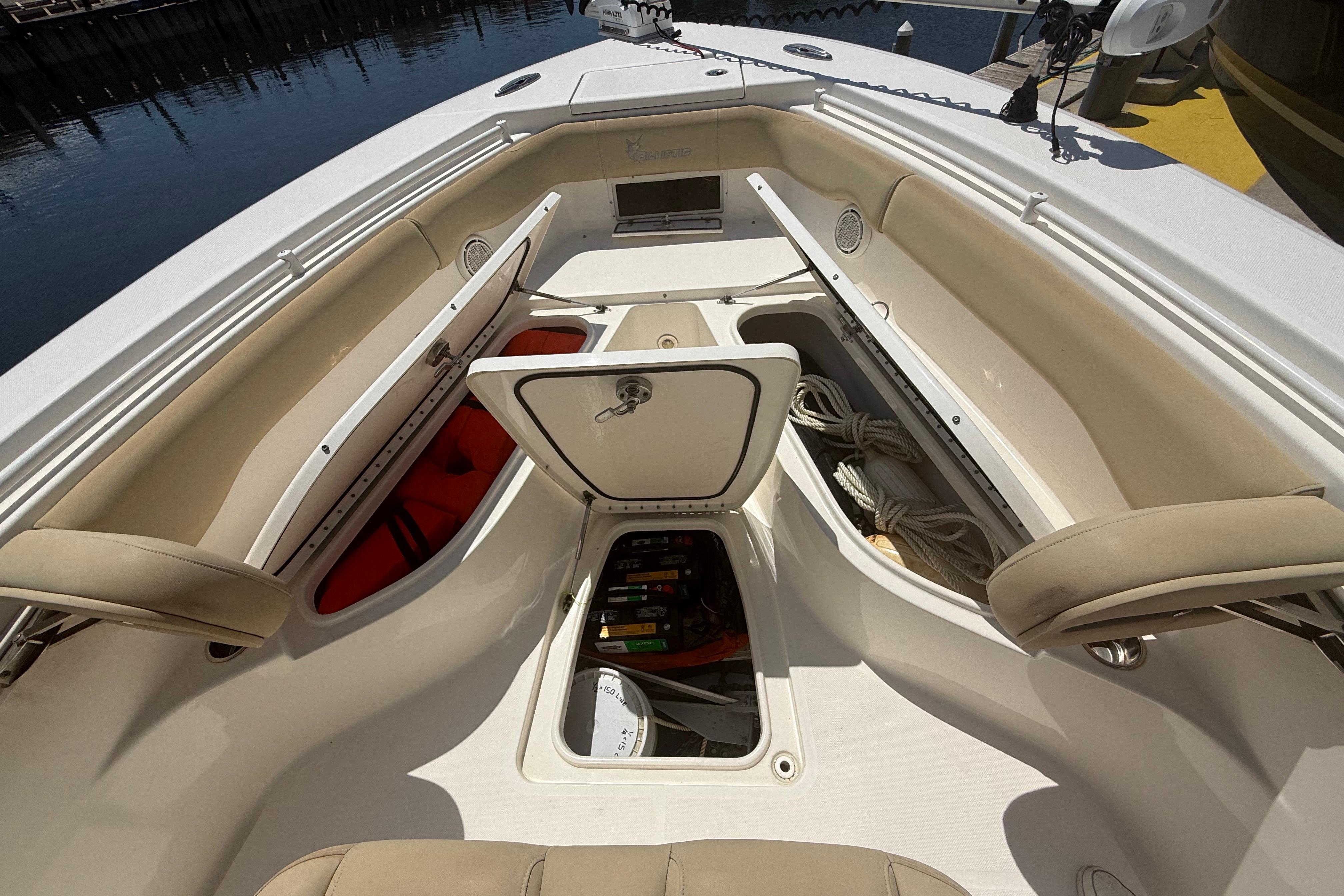 2019 Key West Billistic 281 Center Console boat interior with storage compartments open.