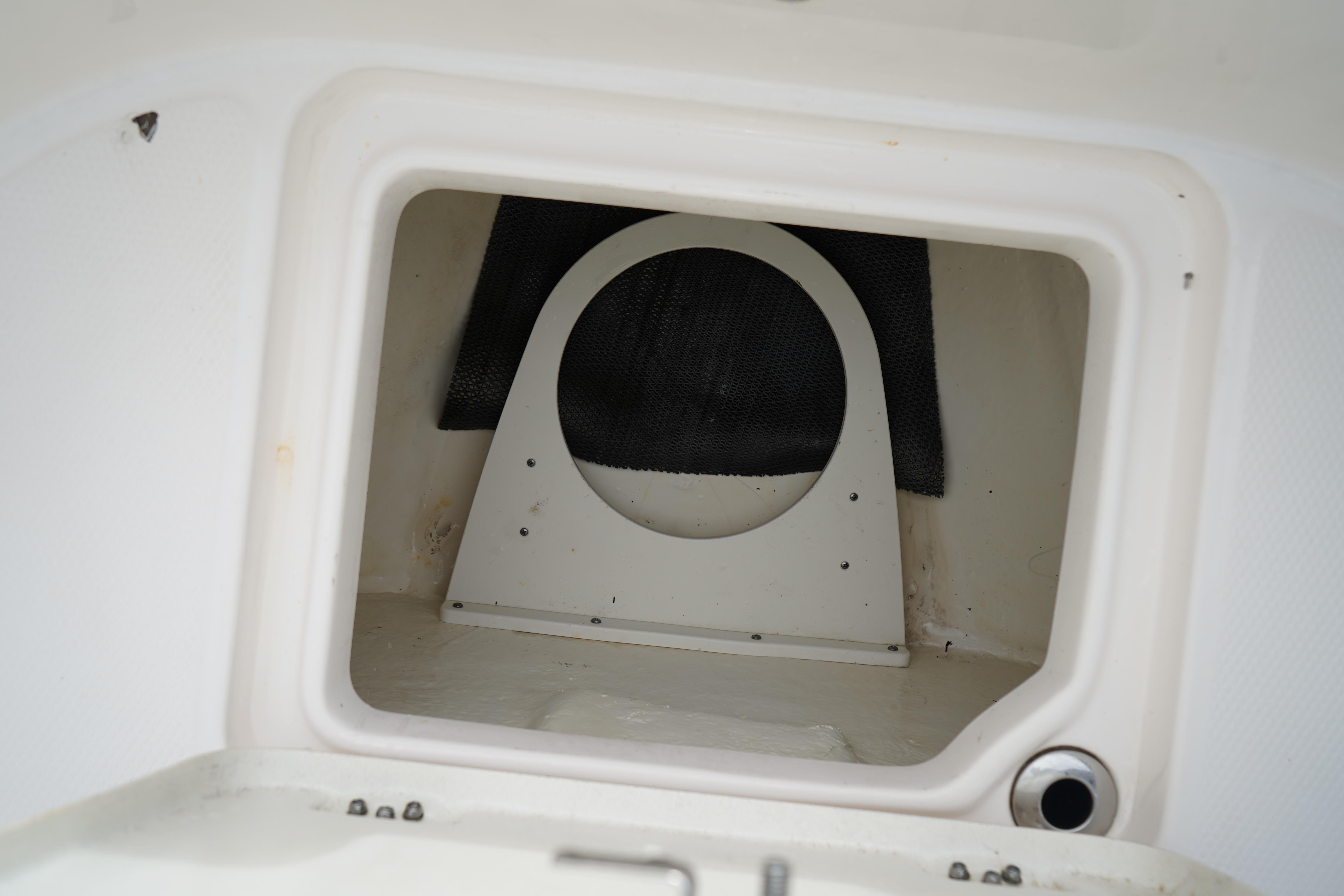 2023 Robalo R222 Center Console storage compartment interior view.