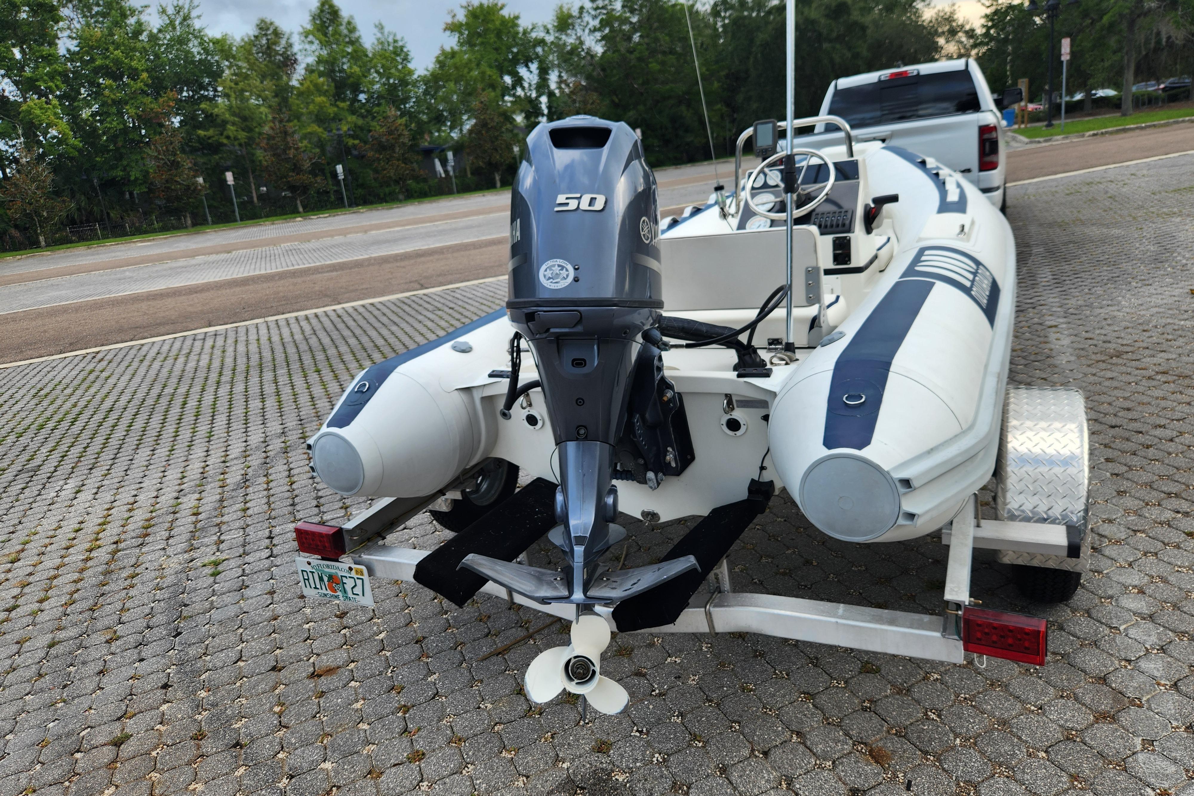 2019 Novurania DL 400 boat on trailer with Yamaha 50 outboard motor.