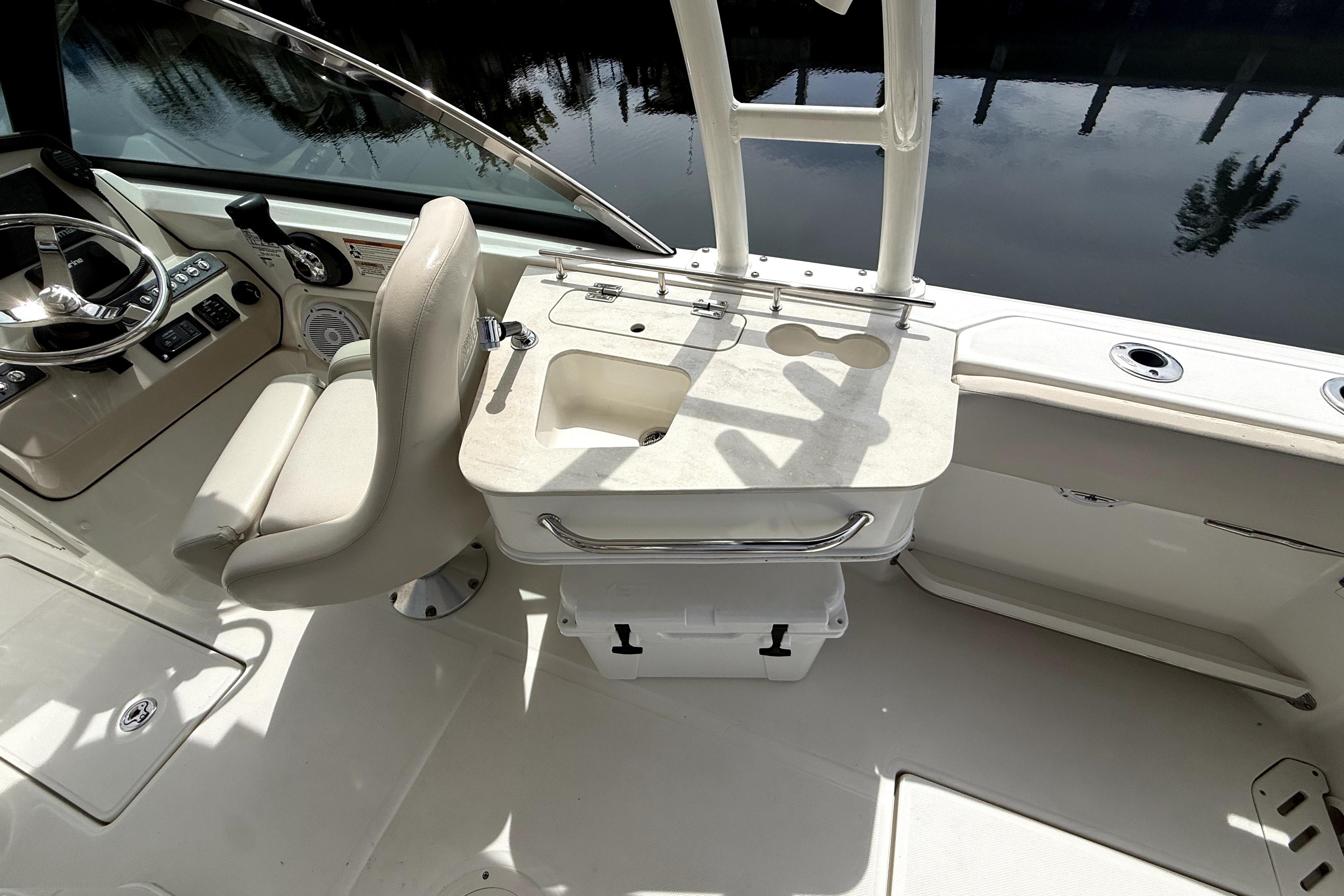 2018 Boston Whaler 230 Vantage boat interior with helm, seating, and fishing station.