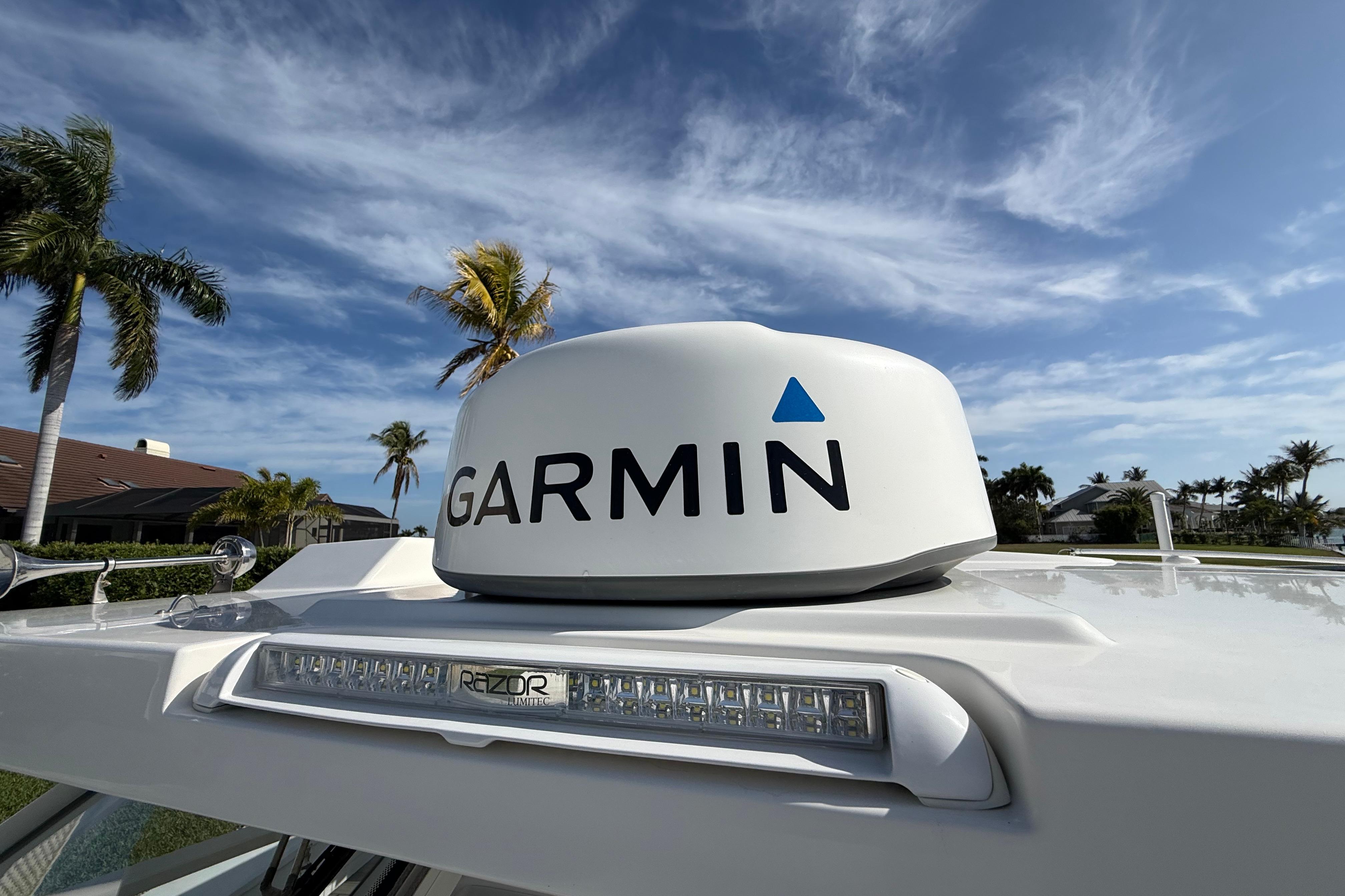 Garmin radar on 2021 World Cat 400 DC-X boat under clear blue sky.