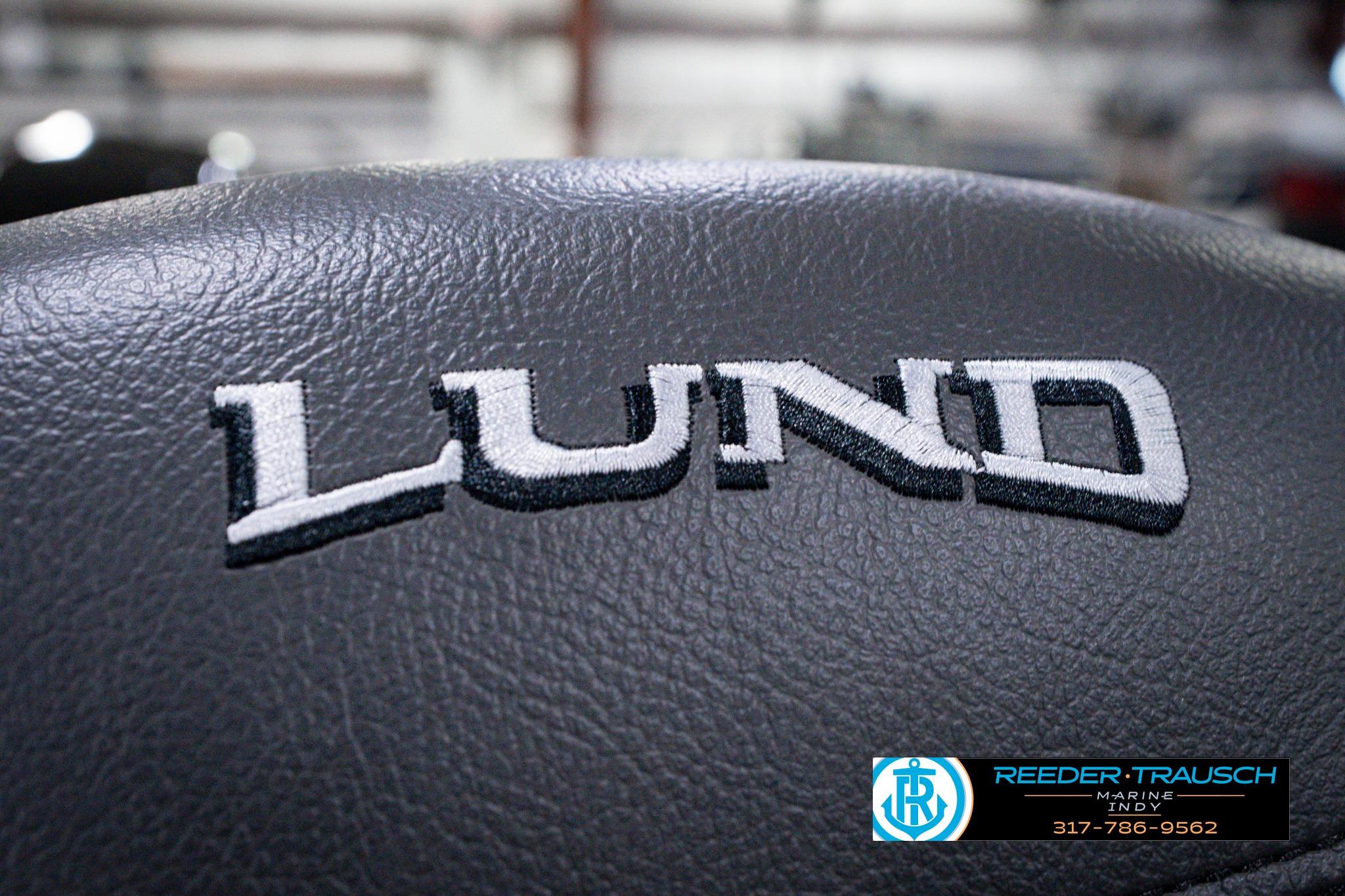 Lund 1600 Fury SS 2026 logo on black leather surface, Reeder-Trausch Marine branding.