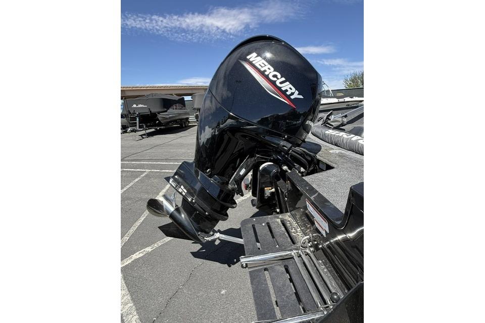 2025 Tracker Pro Guide V-175 WT with Mercury outboard motor in parking lot.