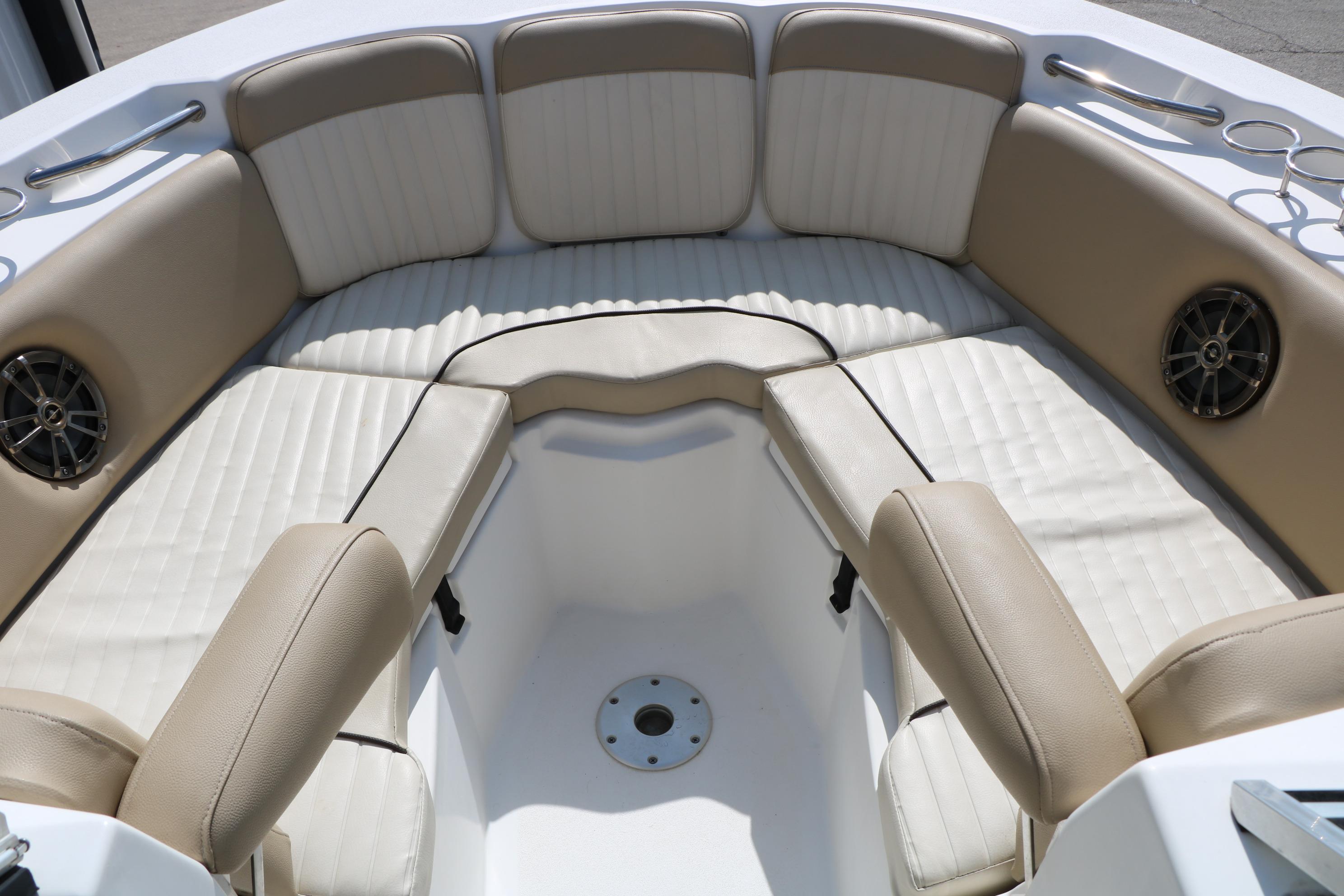 2017 Sea Fox 226 Traveler boat interior with beige cushioned seating and built-in speakers.