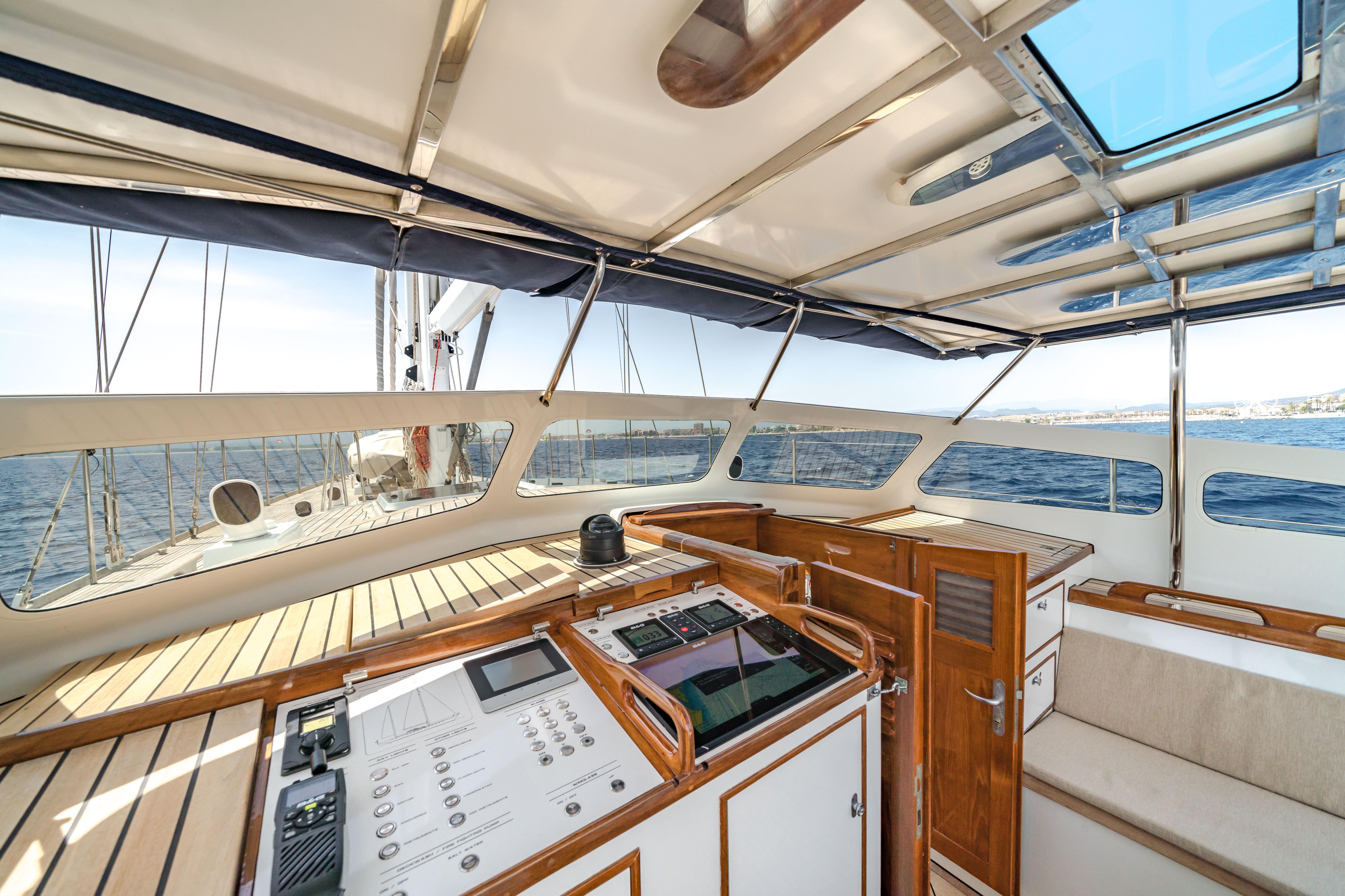 Luxurious 1987 Nordia Van Dam 82 ketch yacht interior with navigation controls and ocean view.