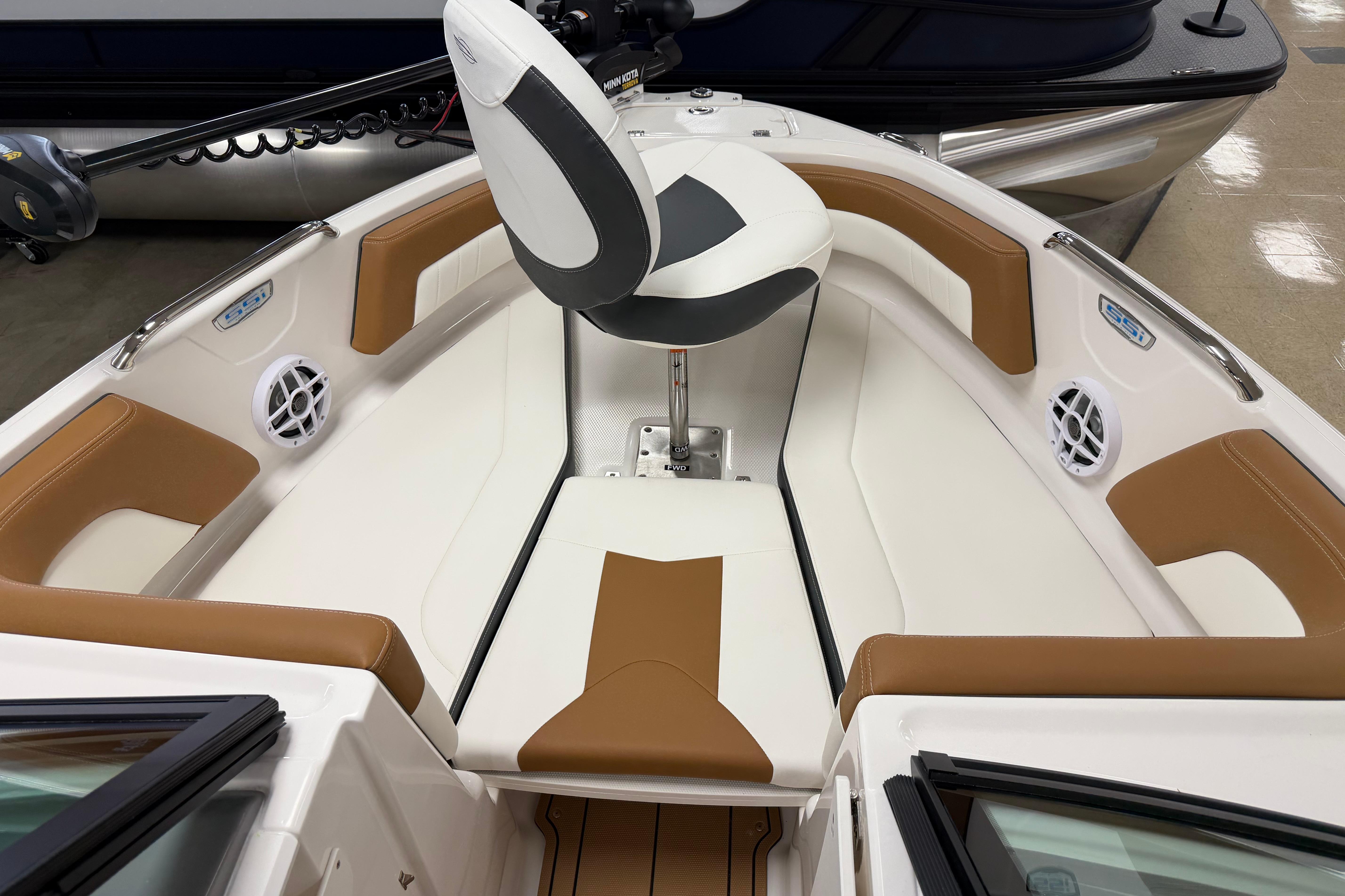 2026 Chaparral 21 SSi Ski & Fish boat interior with tan and white seating.