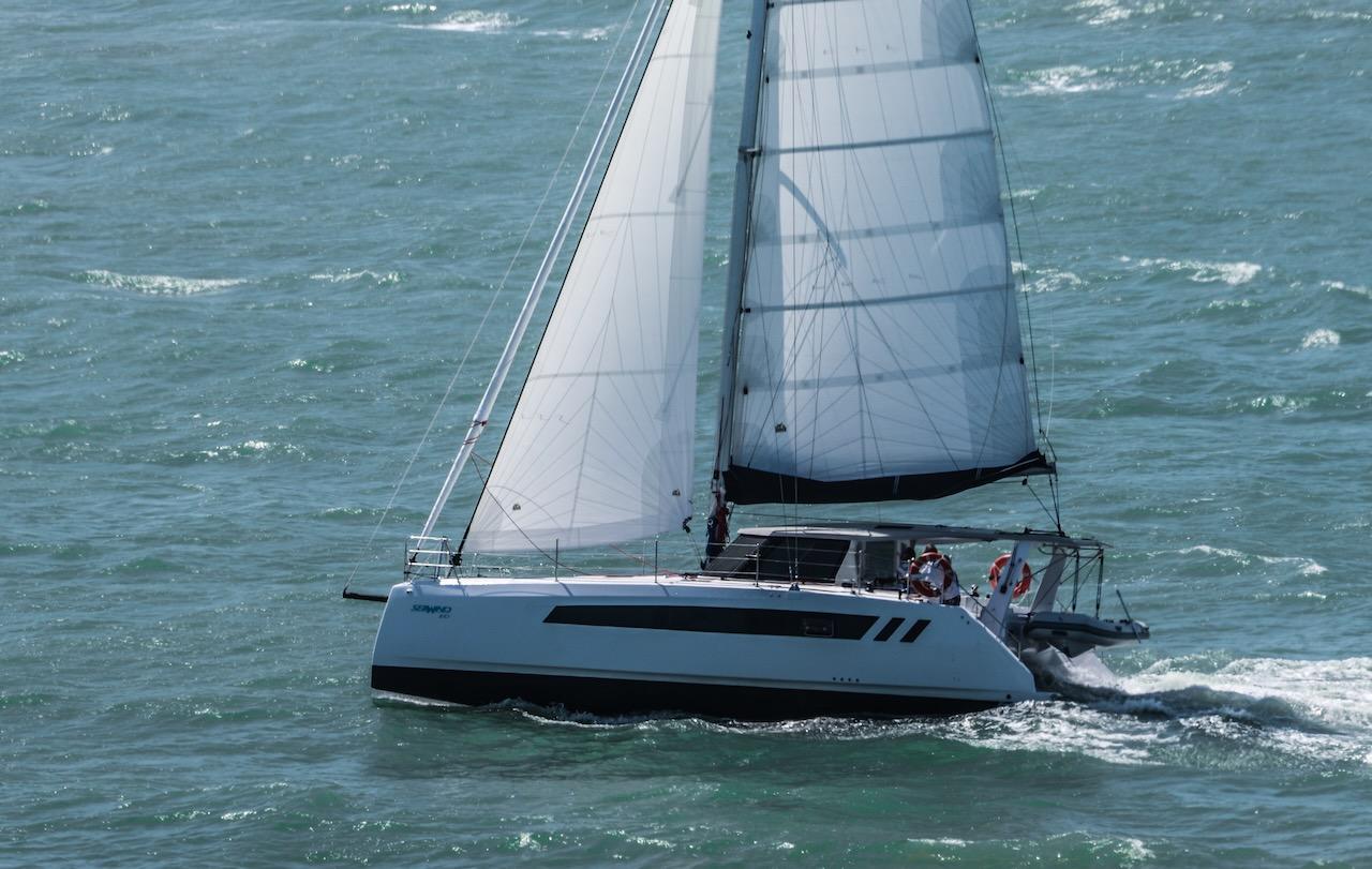 2025 Seawind 1170 sailing on open water with full sails.