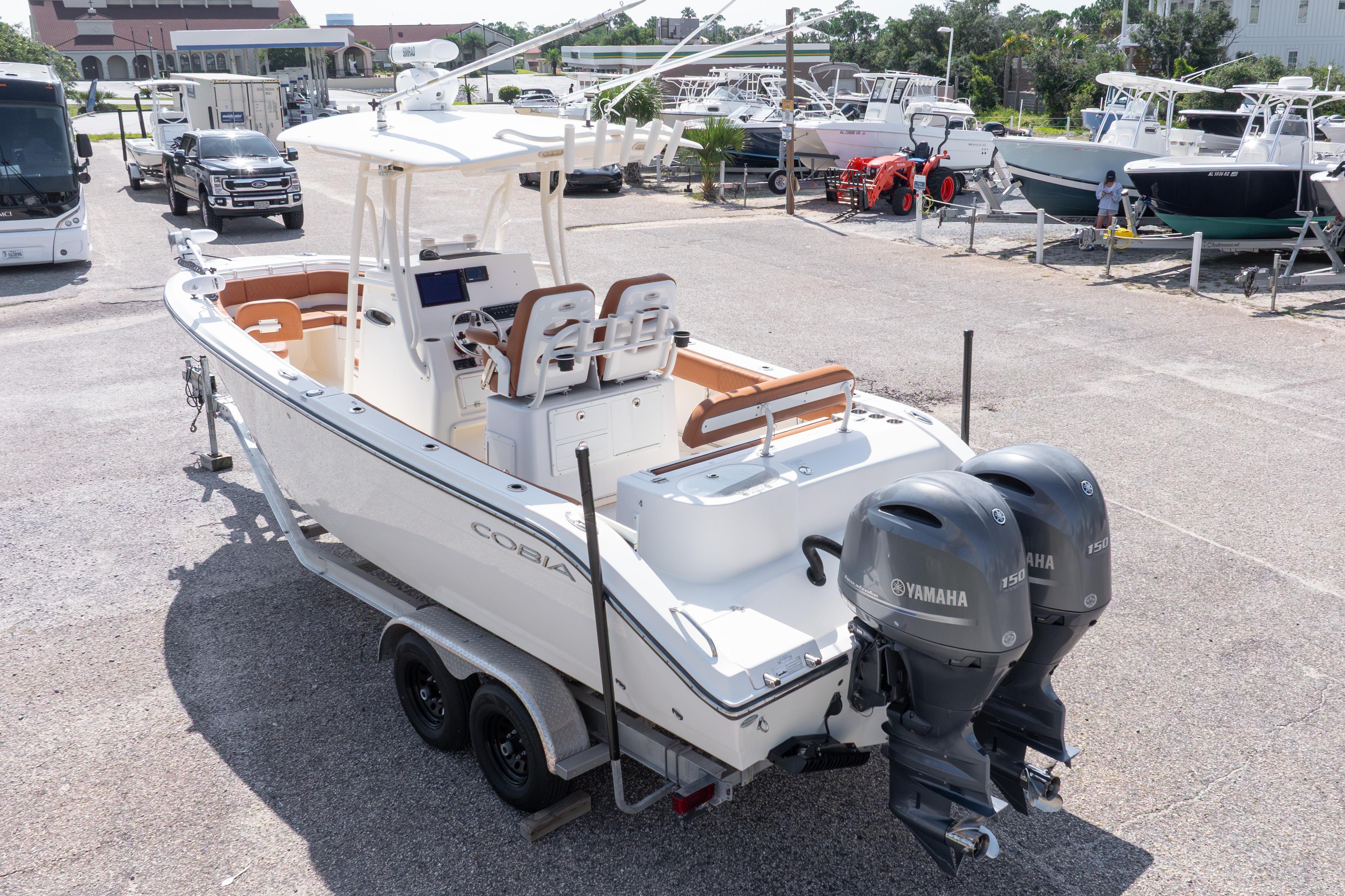 2017 Cobia 261 Center Console boat with dual Yamaha engines on a trailer.