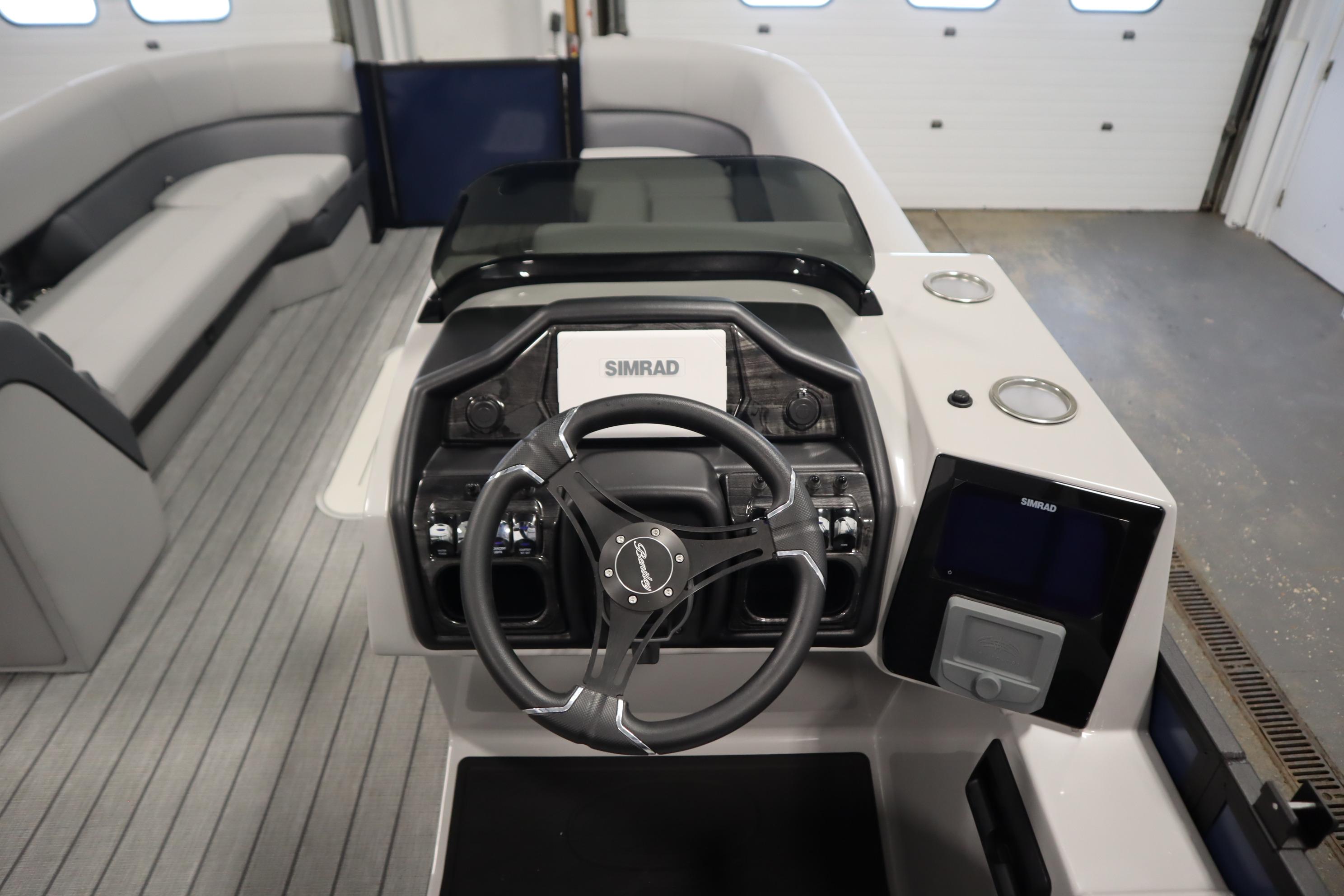 2025 Bentley Pontoons Elite 253 Admiral Tri-toon dashboard with steering wheel and controls.
