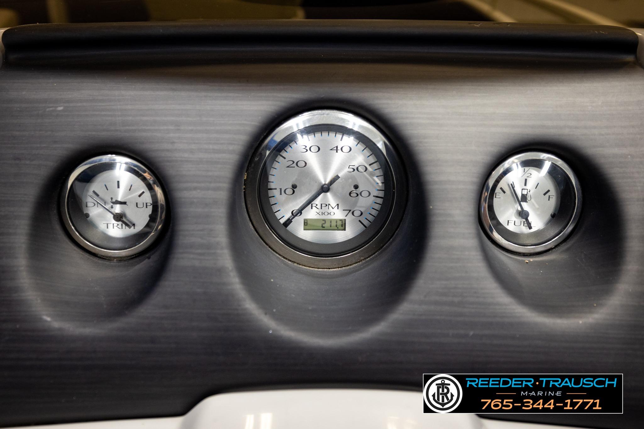 Dashboard gauges of a 2021 Bennington 20 SV boat, showing trim, RPM, and fuel levels.