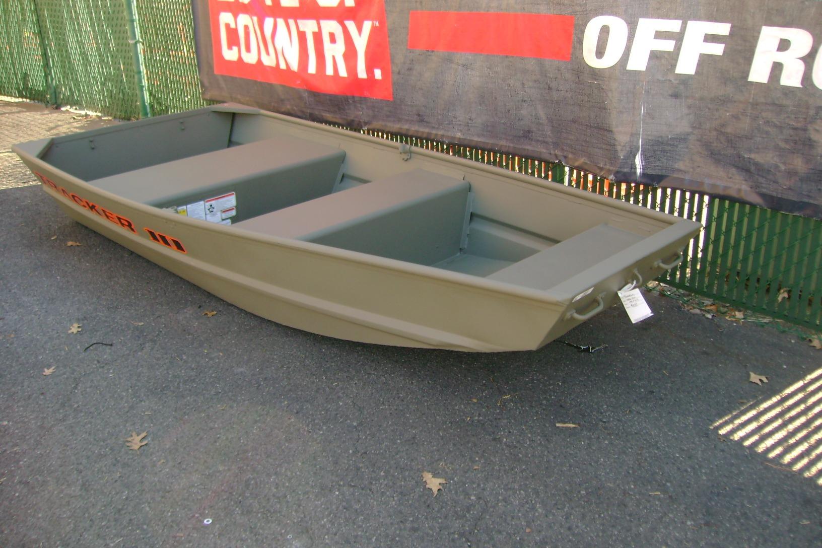 2026 Tracker Grizzly 10 Jon boat displayed outdoors on pavement.