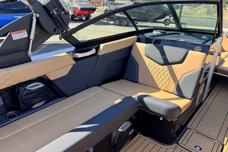 2026 MasterCraft XT22 boat interior with tan and gray seating, showcasing modern design.