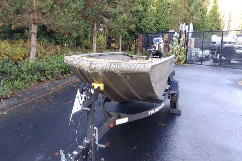 2026 Tracker Grizzly 1650 T Prairie Wings Edition boat on trailer in outdoor setting.