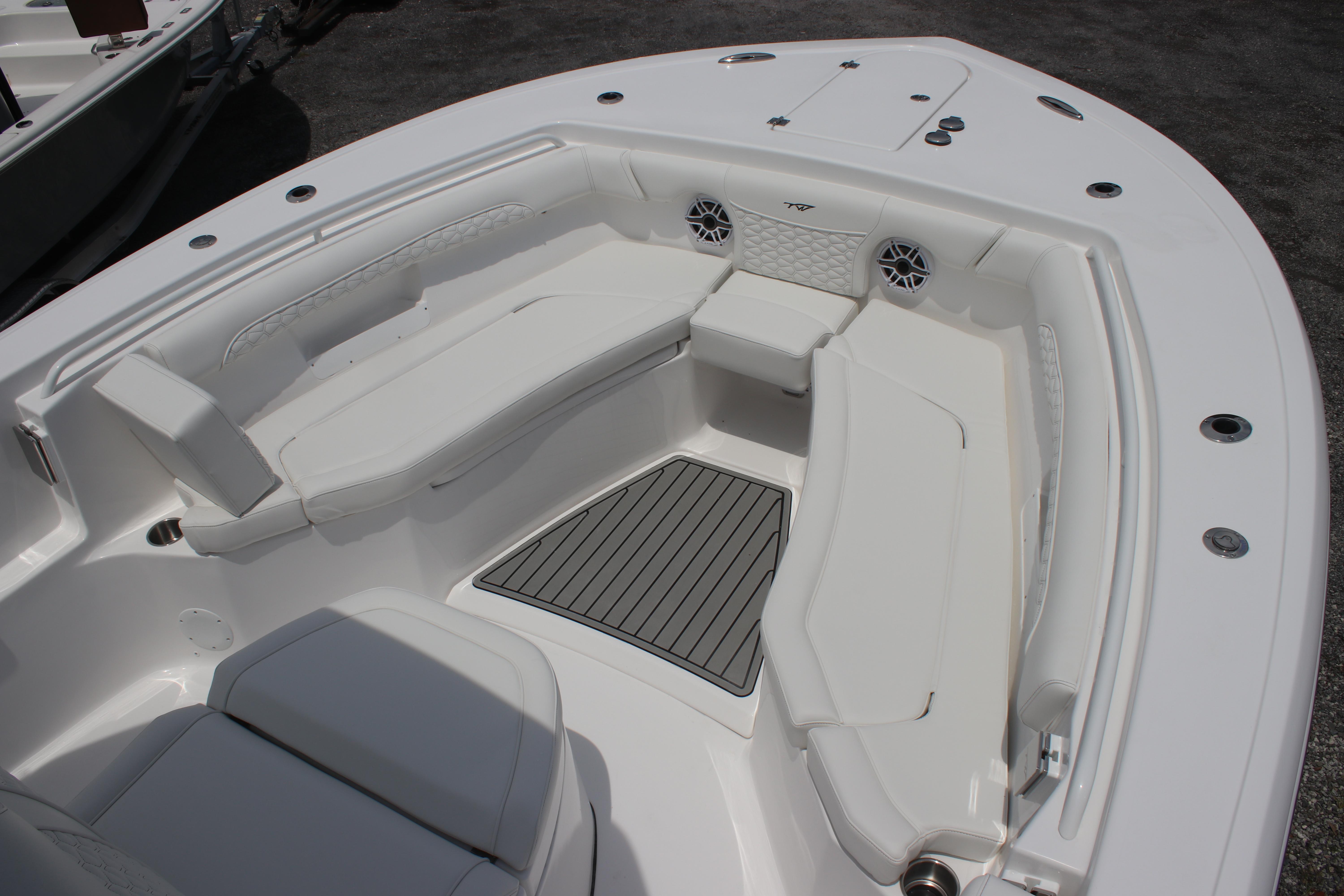 2026 Tidewater 272 LXF boat interior with white seating and deck.