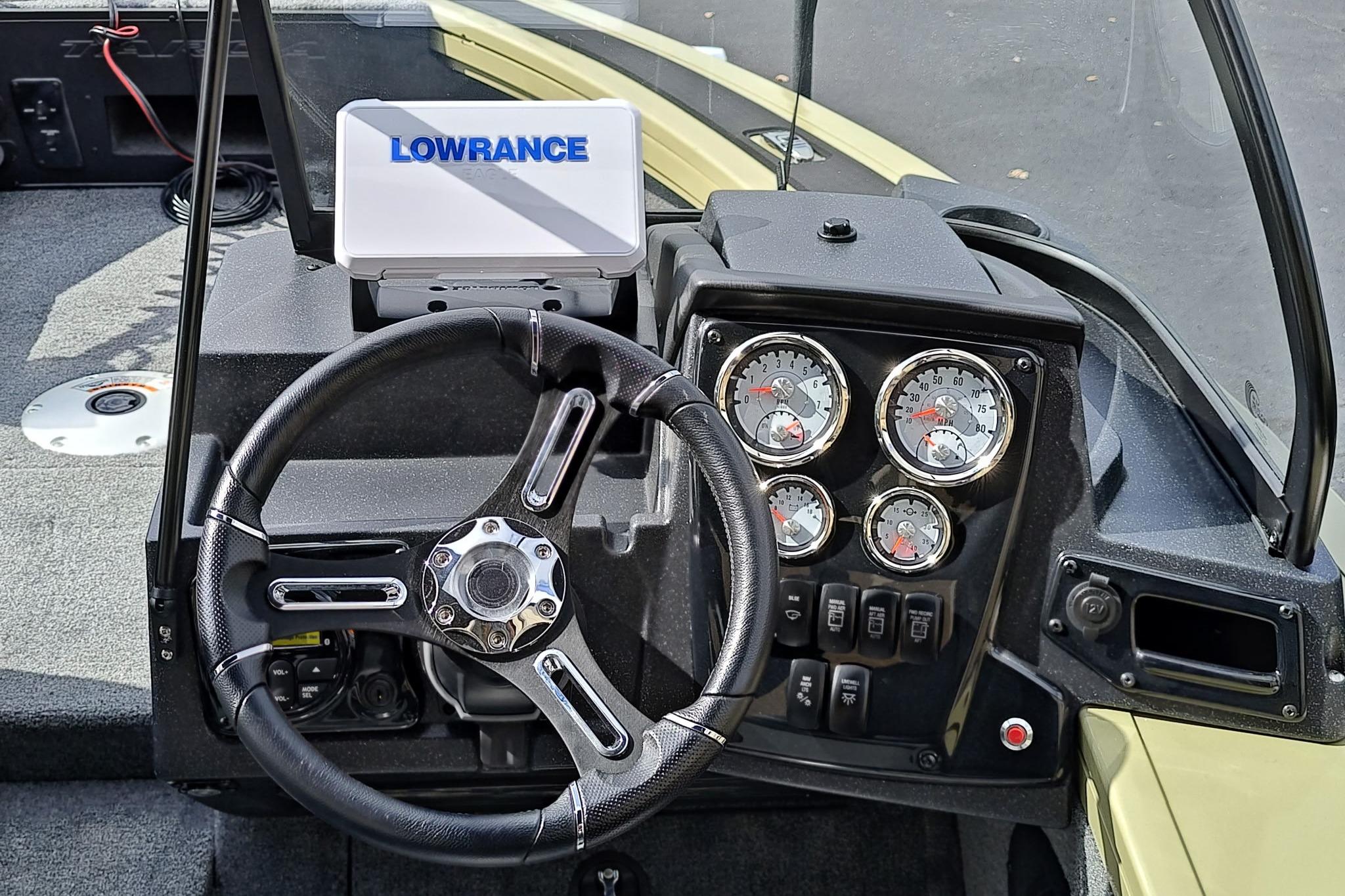 Steering console of 2026 Tracker Targa V-18 Combo with Lowrance display and gauges.