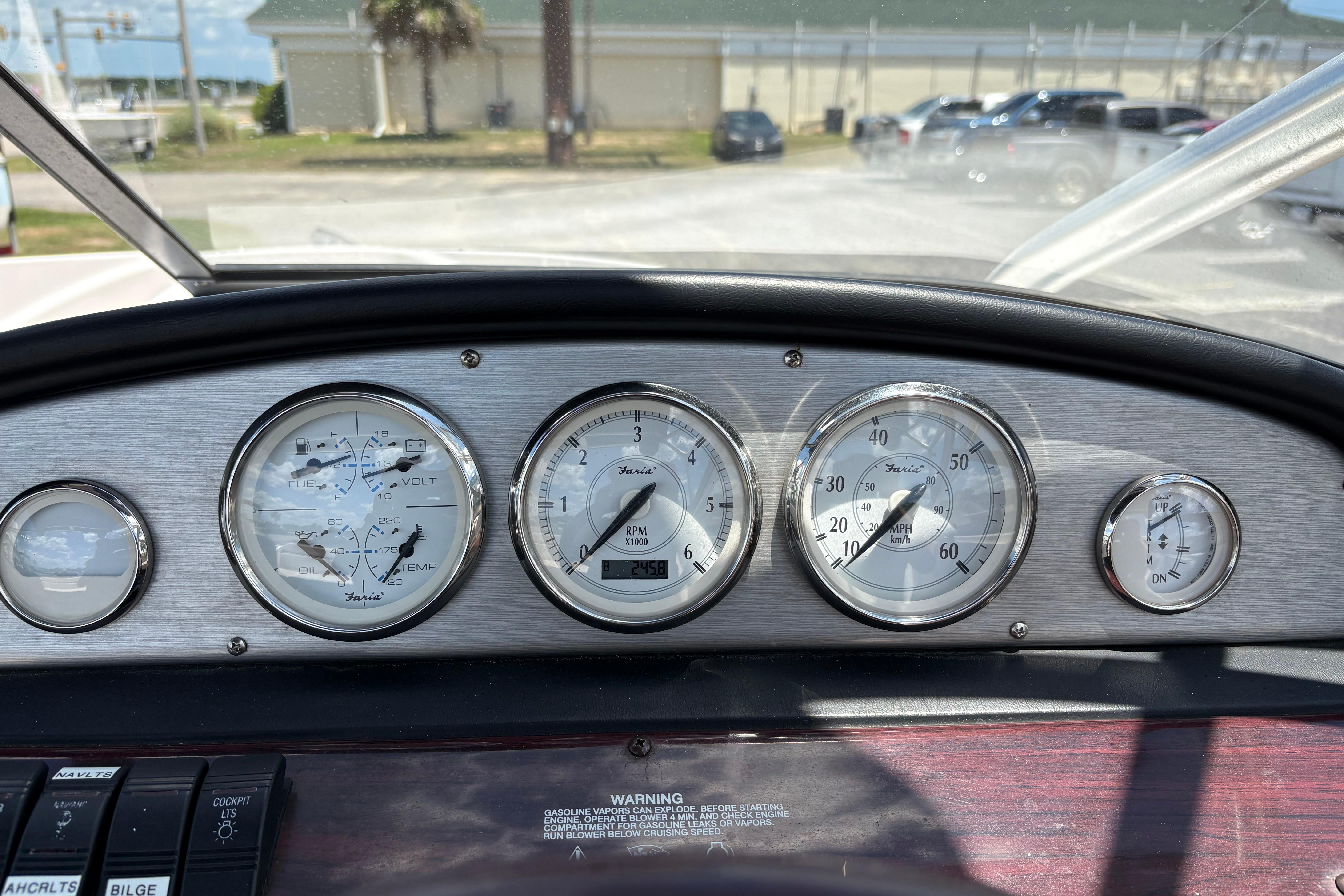 Dashboard of a 2008 Regal 1900 Bowrider boat with gauges and controls.