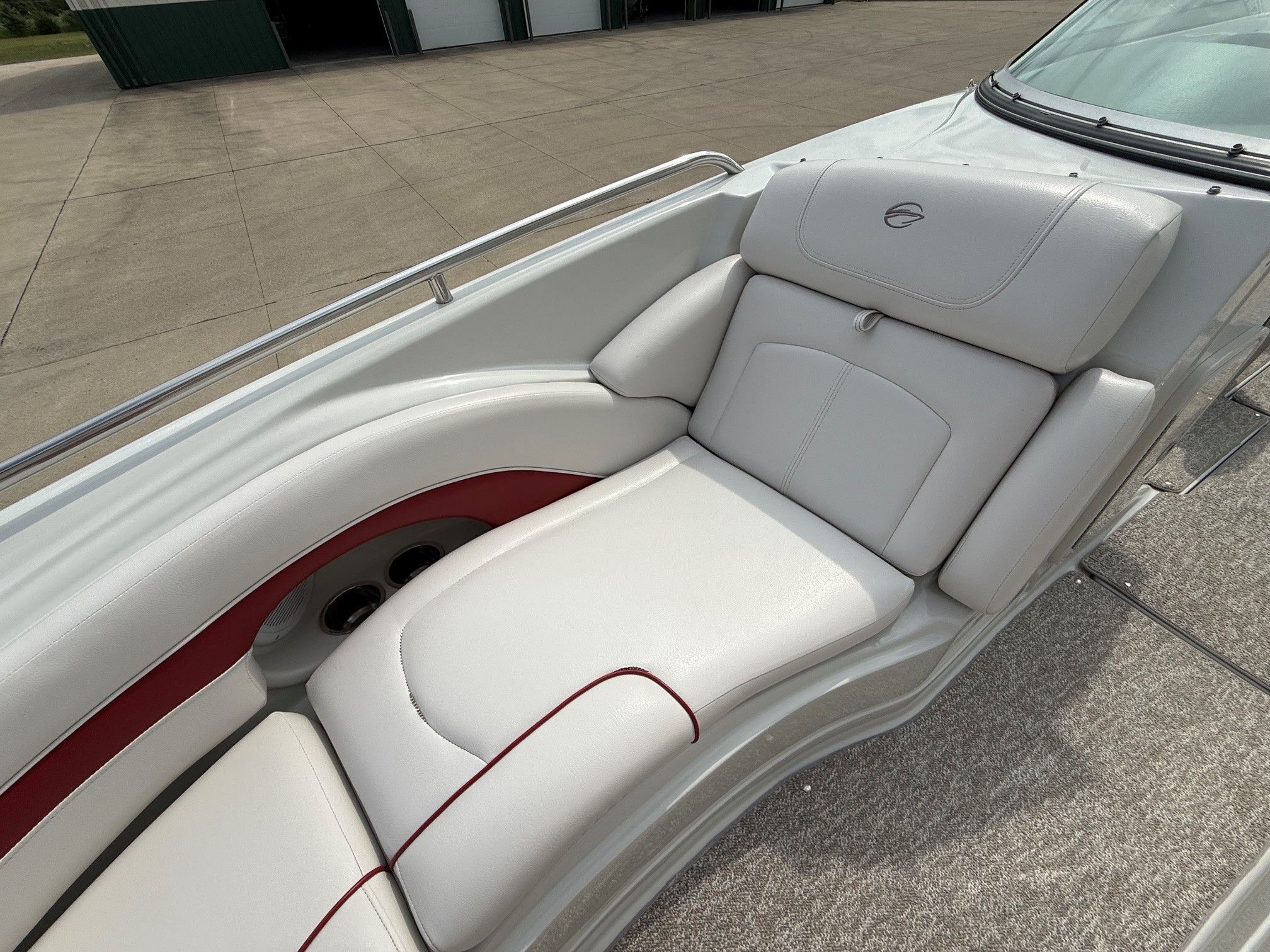 The image shows a white lounging area on a 2012 Crownline 252 EX boat.