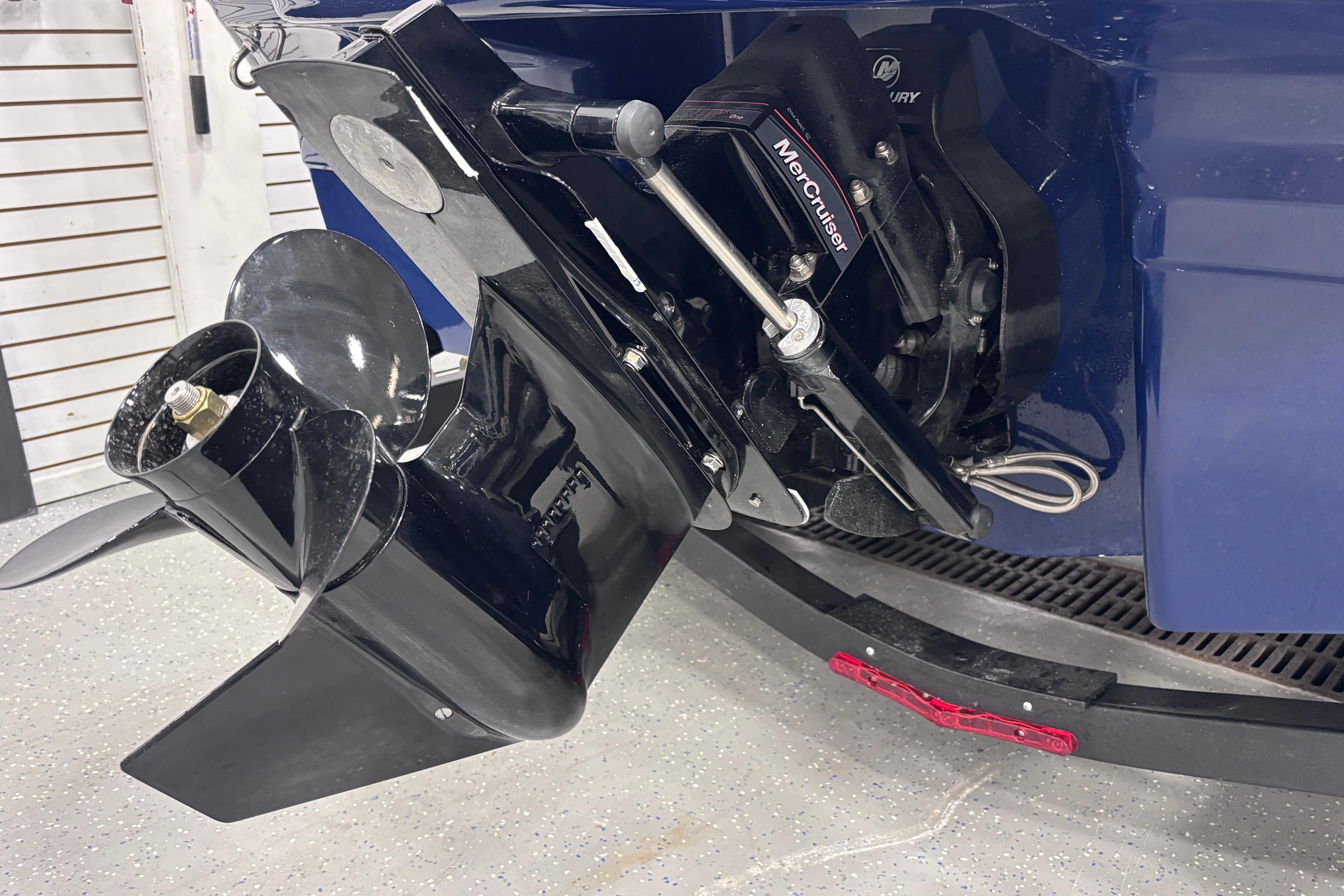 2026 Chaparral 21 SSi boat with MerCruiser outdrive, close-up view.