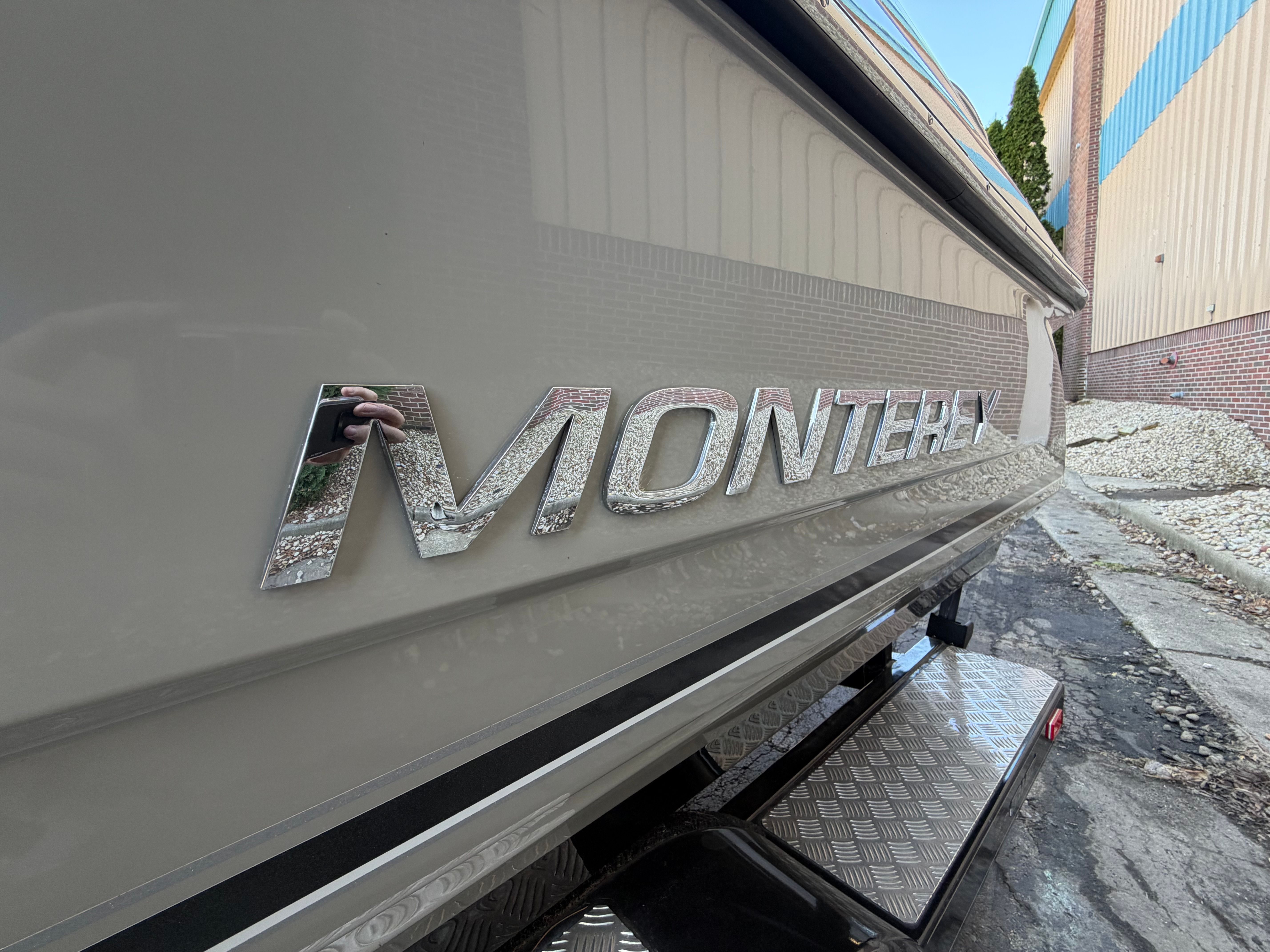 Close-up of the "Monterey" lettering on a boat hull.