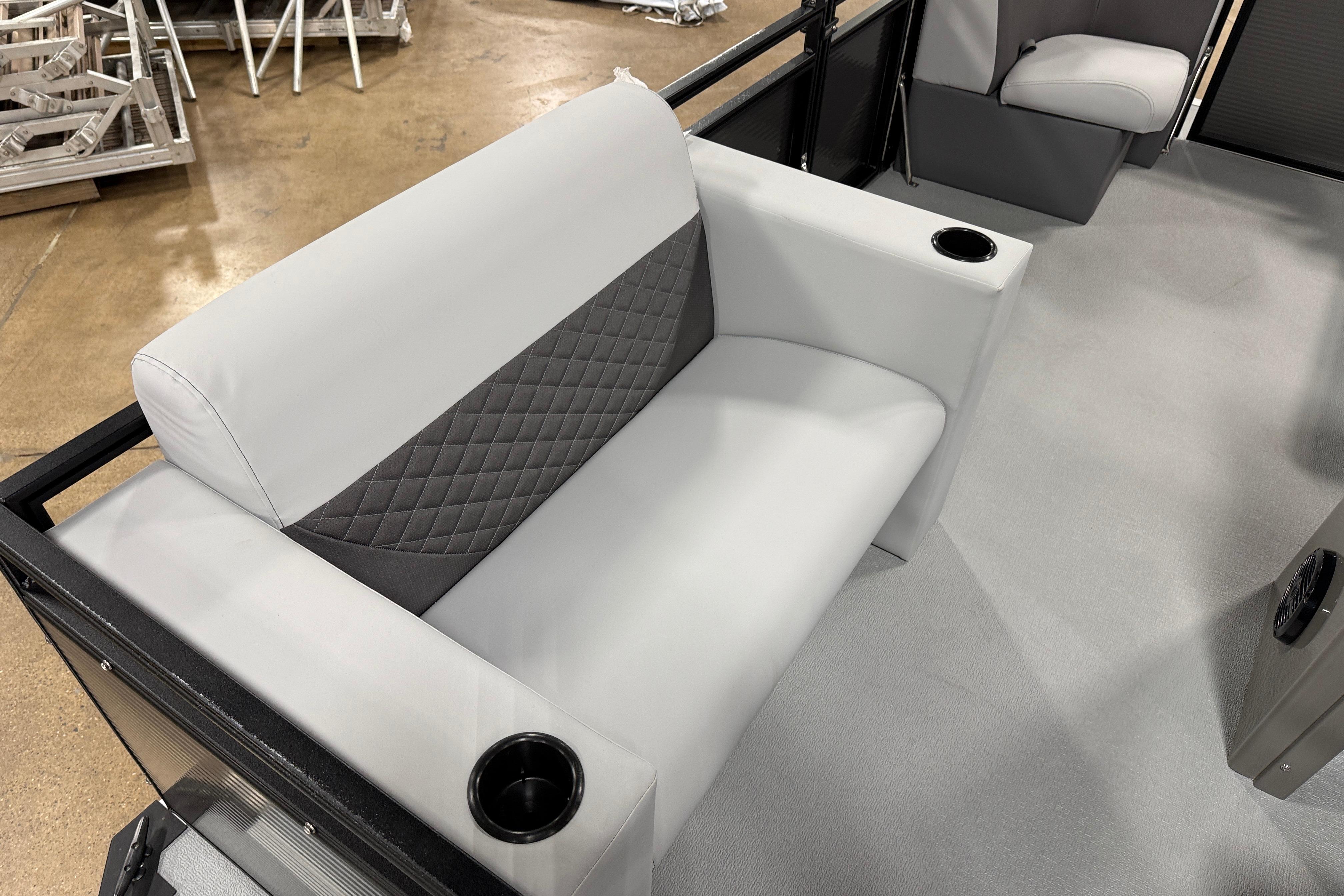2026 Angler Quest 7515 Leisure Quest Cruise boat interior with cushioned seating and cup holders.
