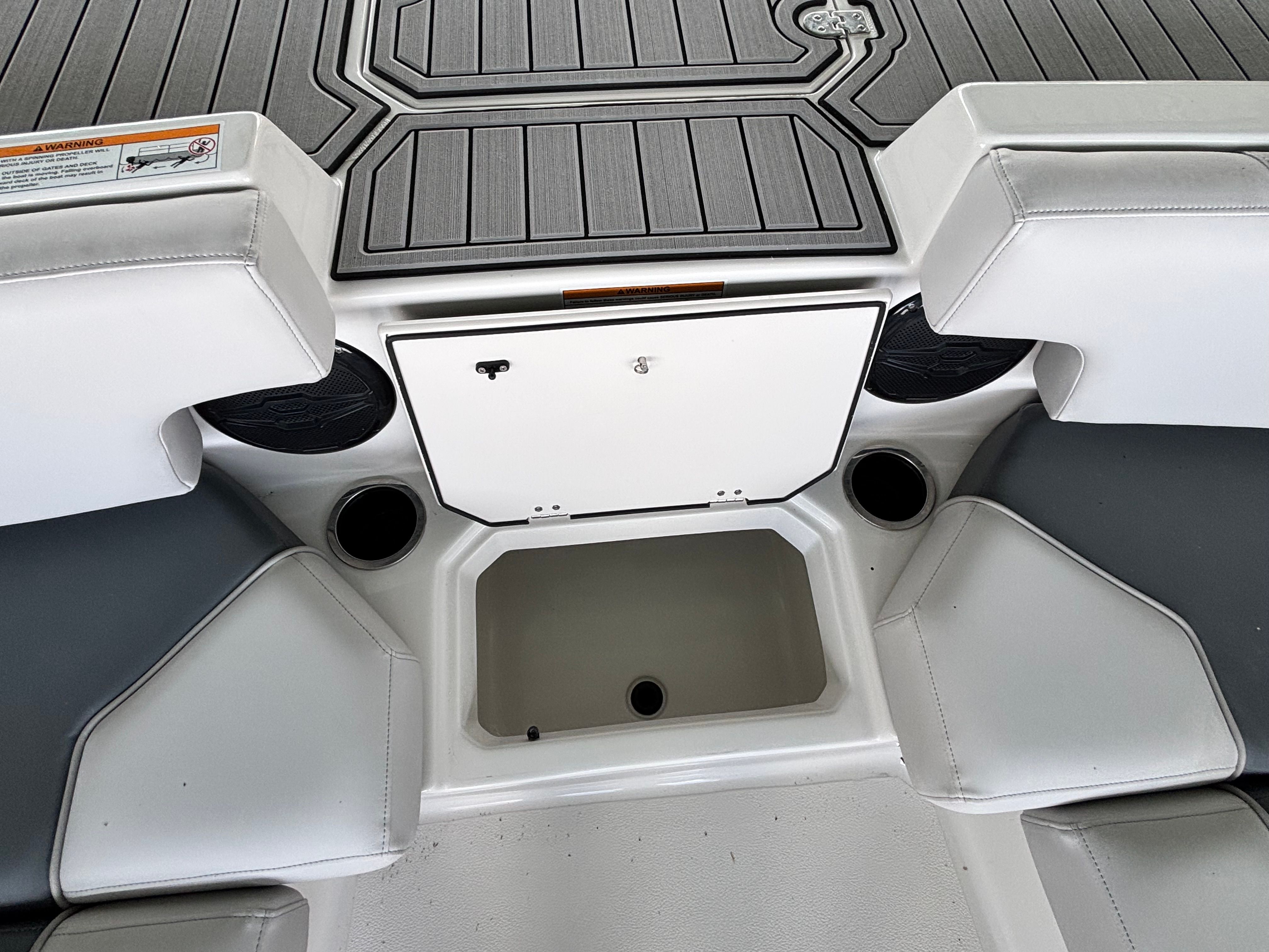 The image shows the interior of a Starcraft 211SVXOB boat with gray and white seating.