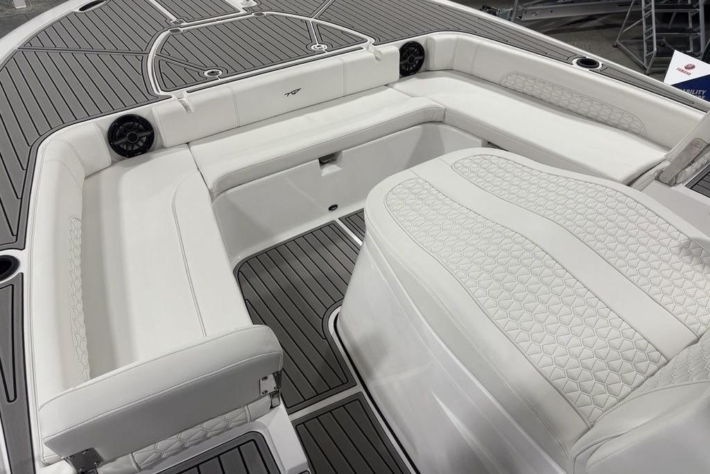 2026 Tidewater 3100 Carolina Bay boat interior with white cushioned seating and sleek design.