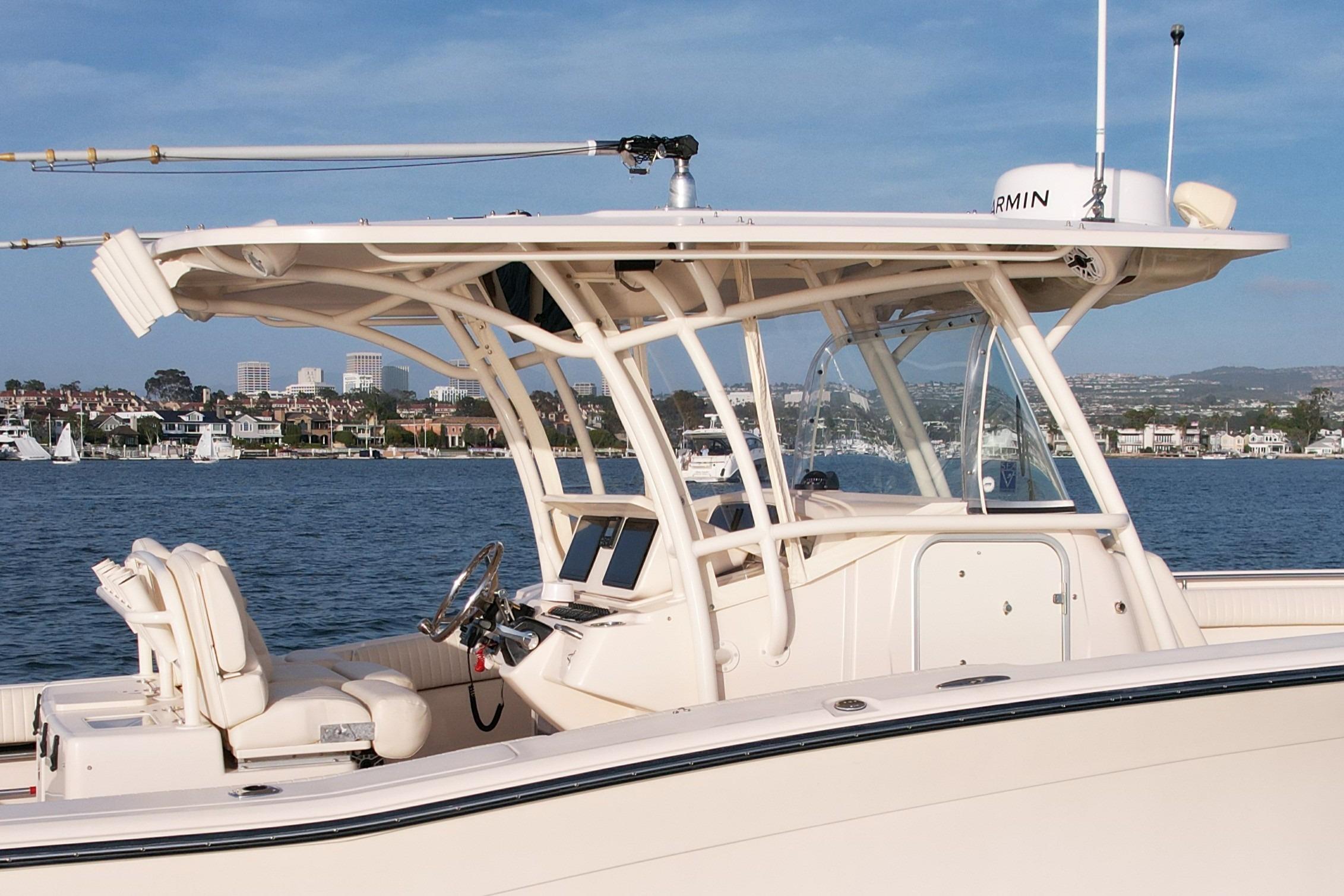 2012 Grady-White Canyon 336 boat on calm waters, featuring sleek design and modern equipment.