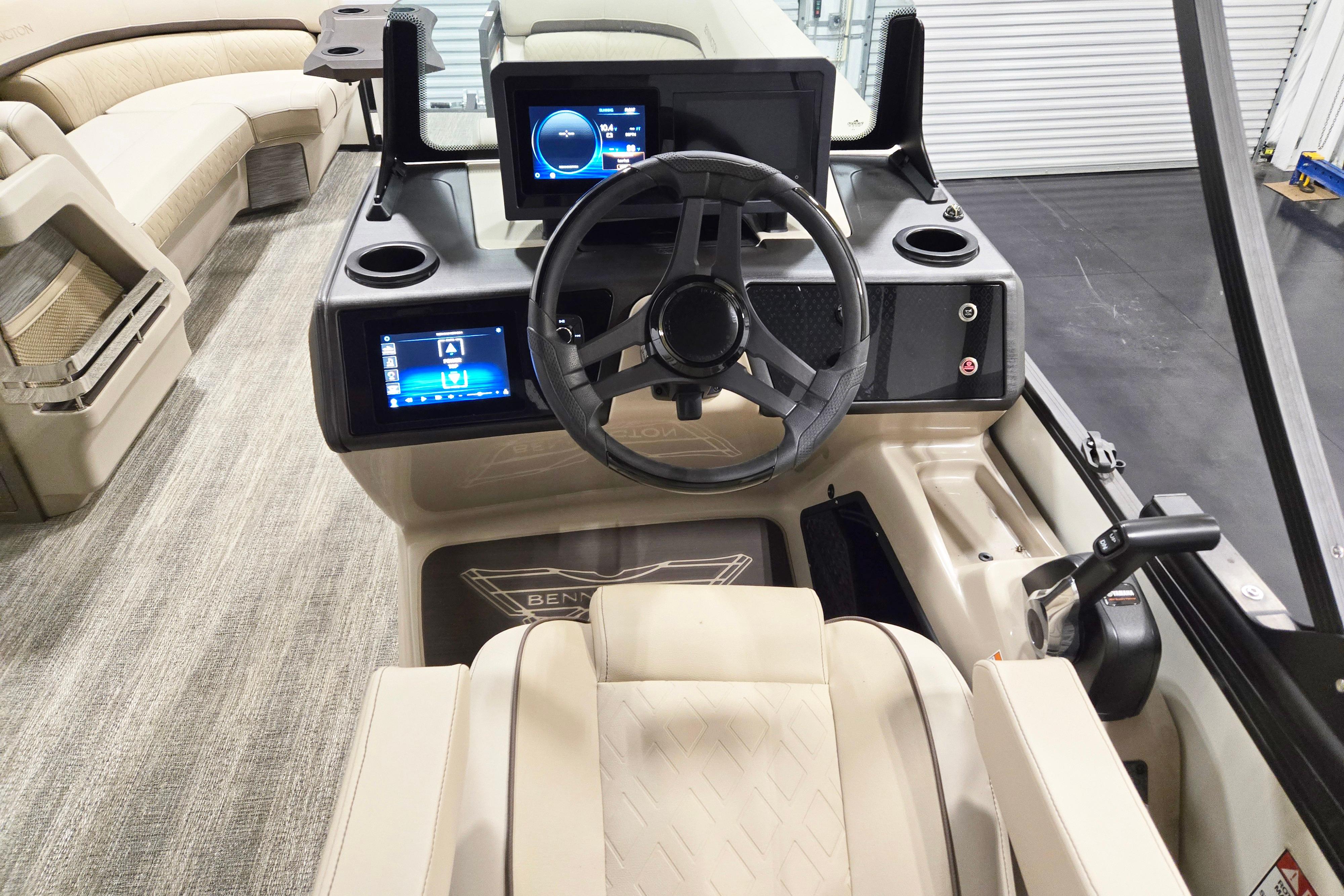 Interior view of 2026 Bennington 24 M boat dashboard with modern controls and steering wheel.