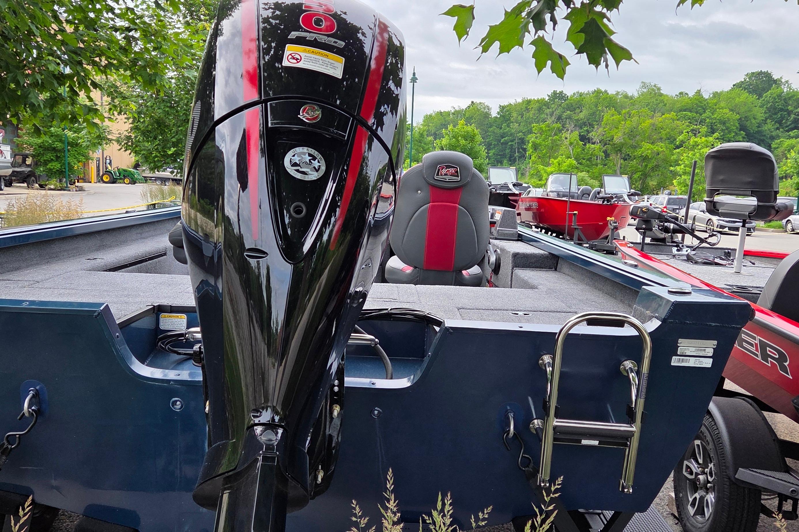 2026 Ranger VS1782SC Reata boat with powerful outboard motor, parked outdoors.