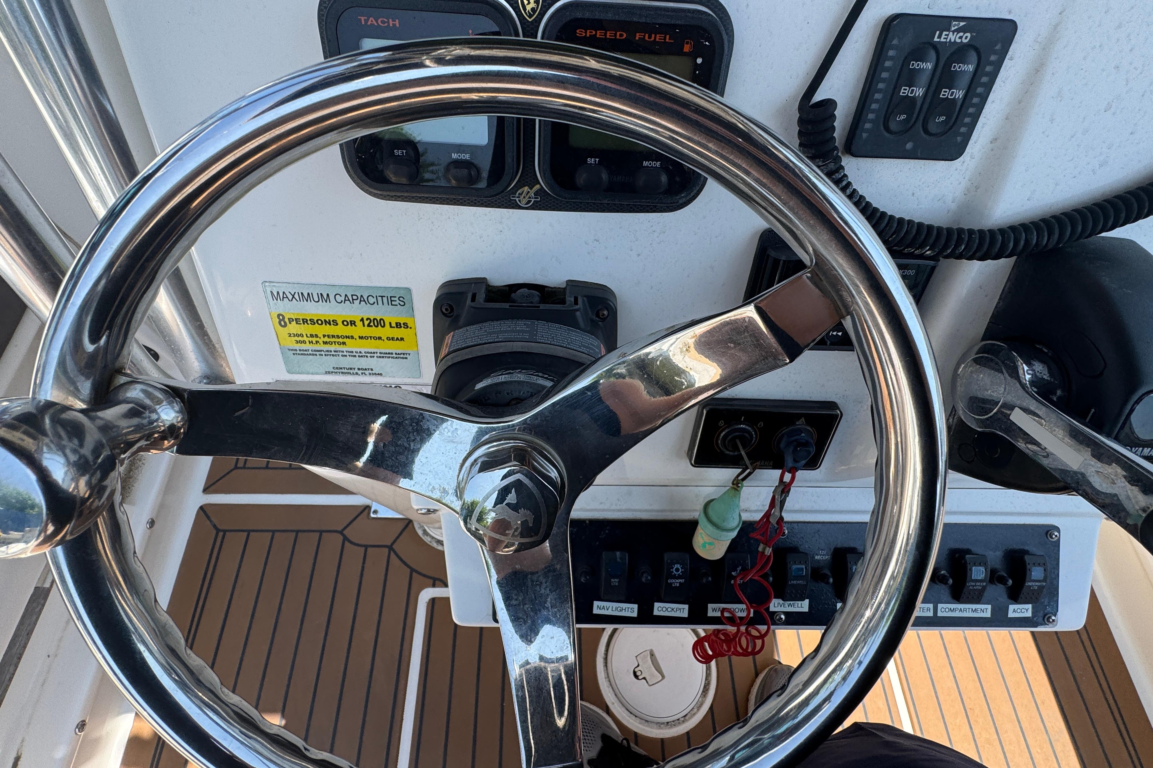 Steering wheel and controls of a 2014 Century 2301 Center Console boat.