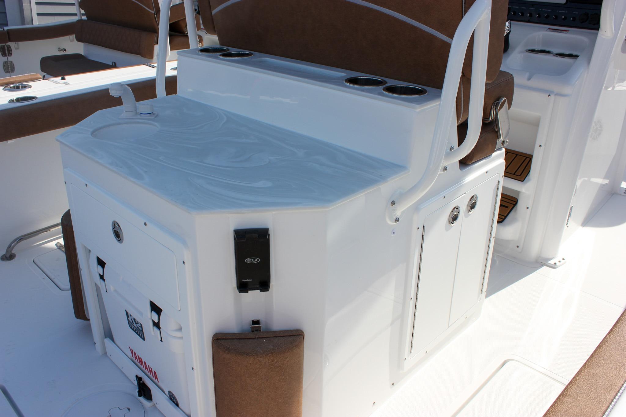 2027 Sea Hunt Ultra 275 SE boat interior with seating and storage compartments.