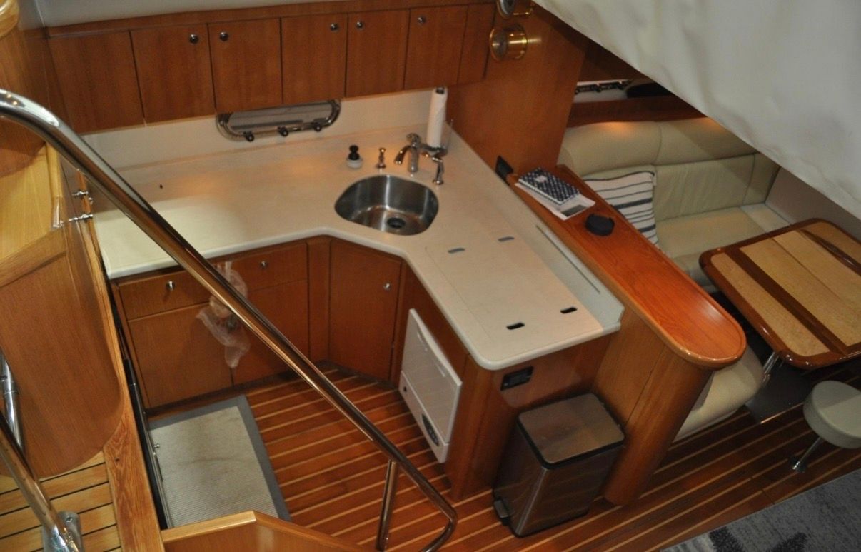 Interior of the 2005 Tiara Yachts 5200 Sovran with kitchen and seating area.