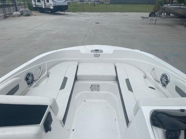 2022 Hurricane SS185 OB boat interior with white seating and speakers.