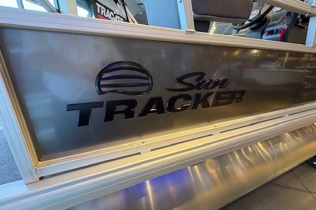 2026 Sun Tracker Bass Buggy 16 XL Select pontoon boat side view with logo.